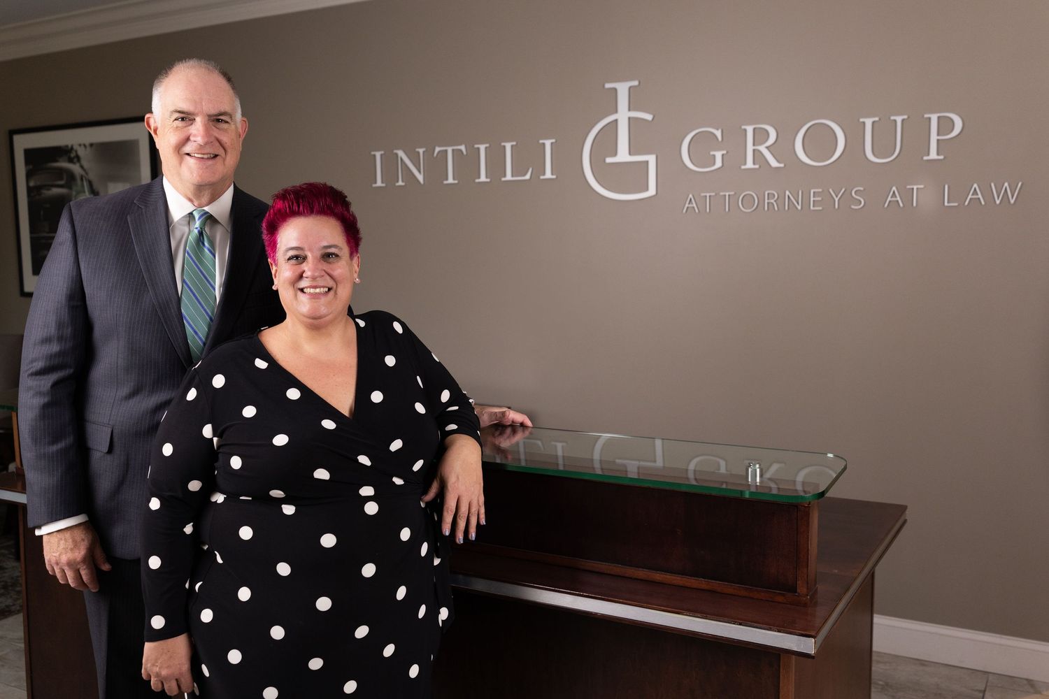 Corporate office interior with Intili Group branding and professional furnishings.