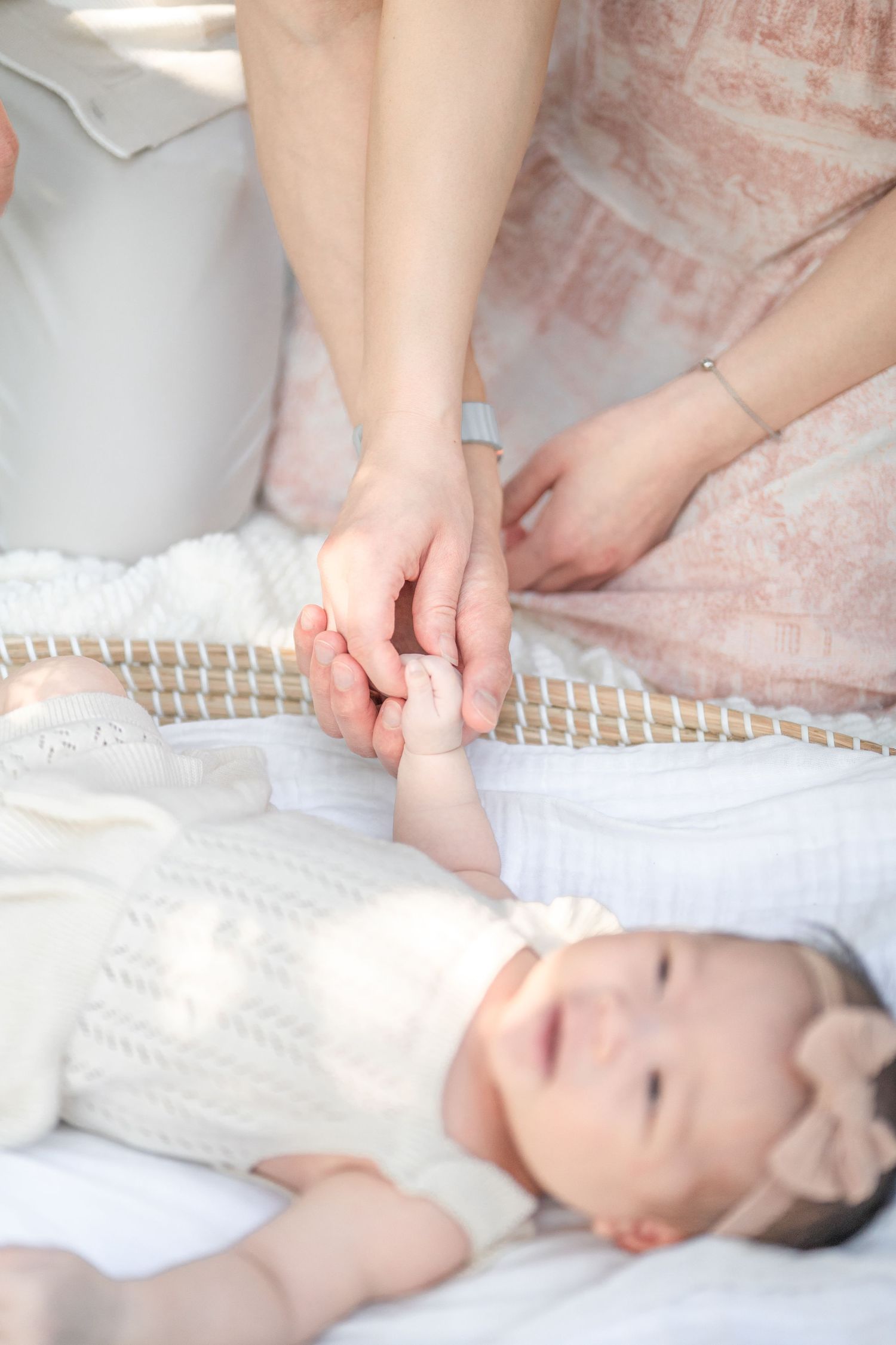 Parents holding their newborn's hands. Herndon photographer