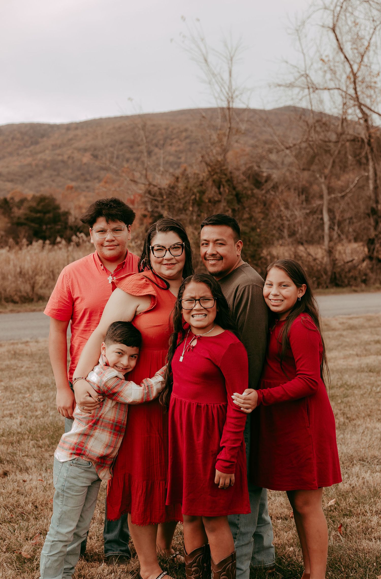 Family embraces for a portrait session at Rockfish Valley Community Center in Nelson County Virginia.