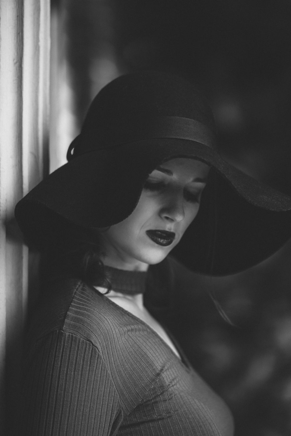 Dramatic black and white Seattle portrait with directional light, cinematic film photography with moody shadows