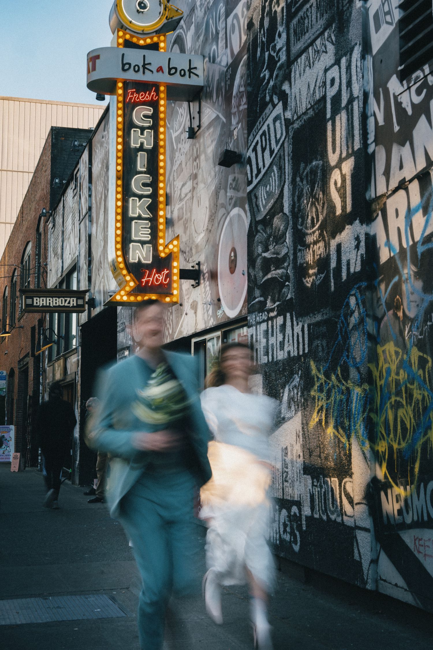 Artistic Seattle couple portrait near Capitol Hill with creative motion blur, urban wedding photography showcasing city's iconic landmarks