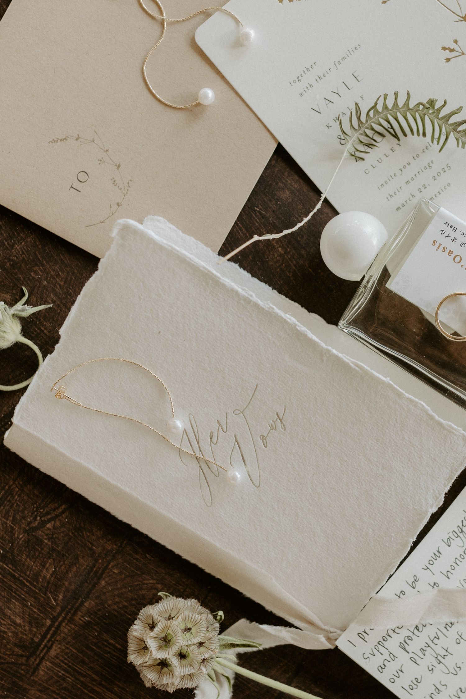 Handcrafted luxury wedding invitation suite with embossed details and minimalist design for Tulum destination wedding
