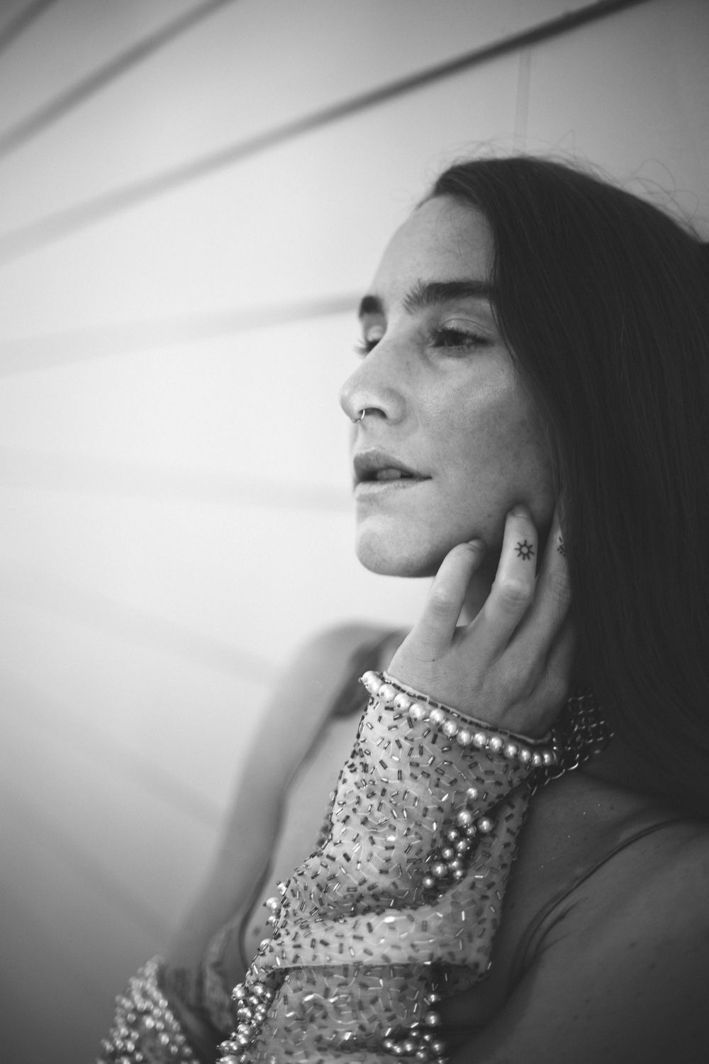 Black and white 35mm profile portrait with dramatic lighting, Seattle cinematic film photography with fashion styling and elegant pose
