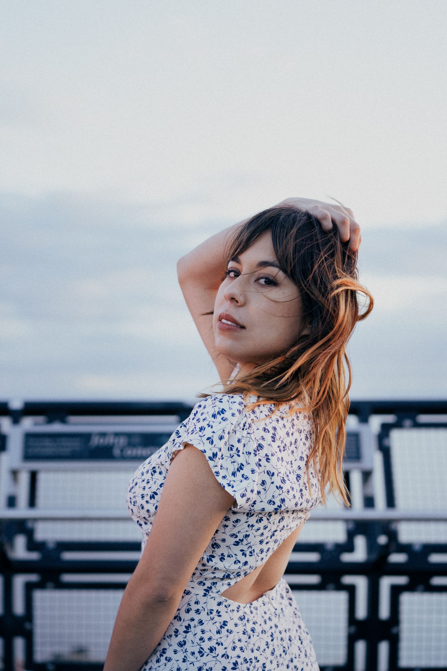 Waterfront portrait with soft natural light, Seattle film photography with delicate floral details and dreamy cinematic aesthetic