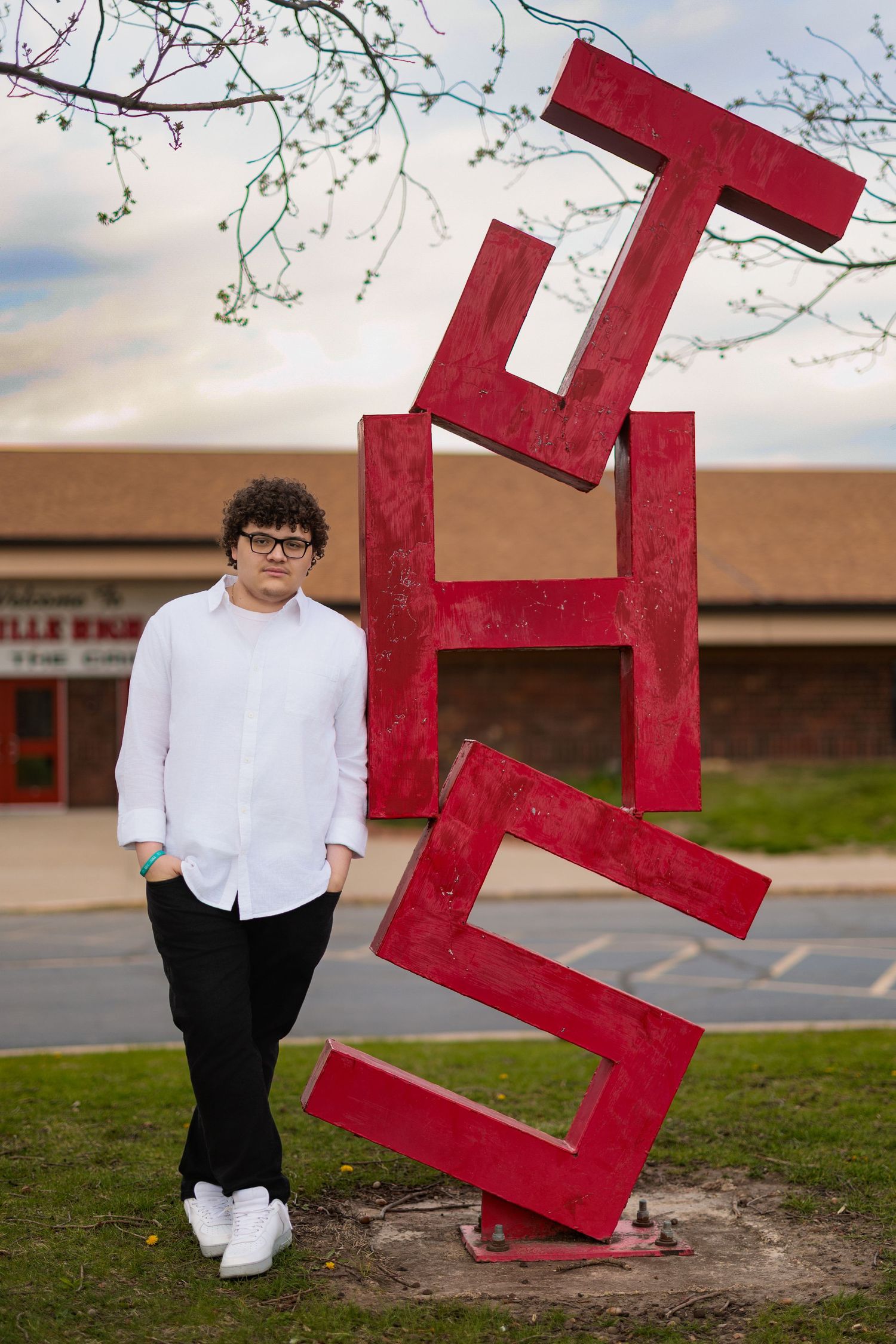 A large red sculptural art installation spelling out 