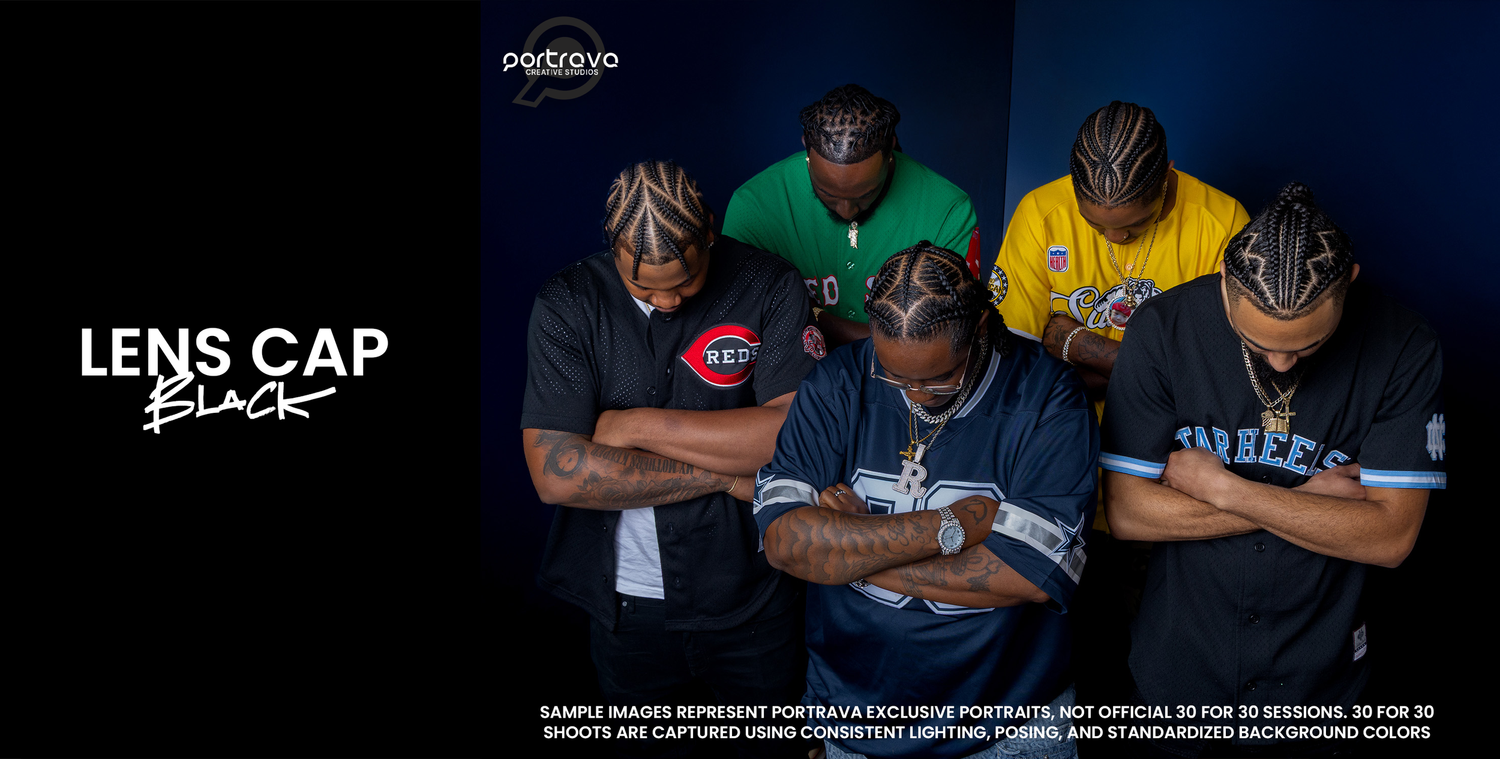 A group of baseball players stand with arms crossed in front of a dark background with stadium lighting. Portrava Creative Studios