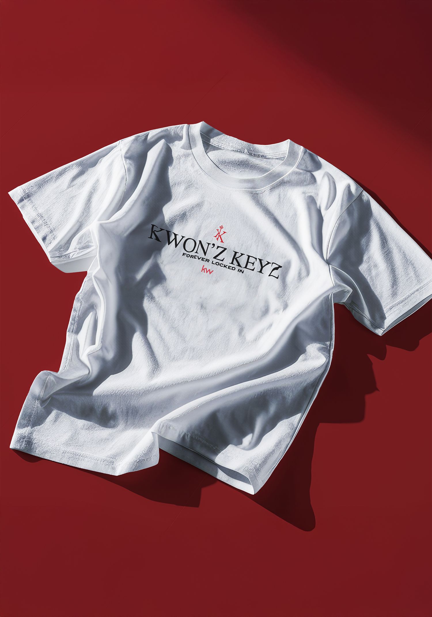 Portrava CS White t-shirt mockup displaying Kwon'z Keyz logo design against red background. Portrava Creative Studios