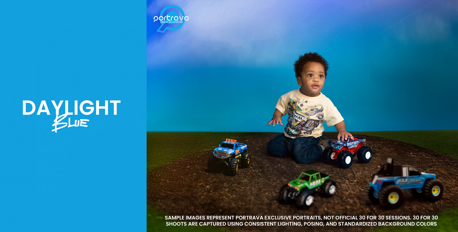 Young child plays with colorful toy trucks and cars against a blue and green gradient background for Daylight collection. Portrava Creative