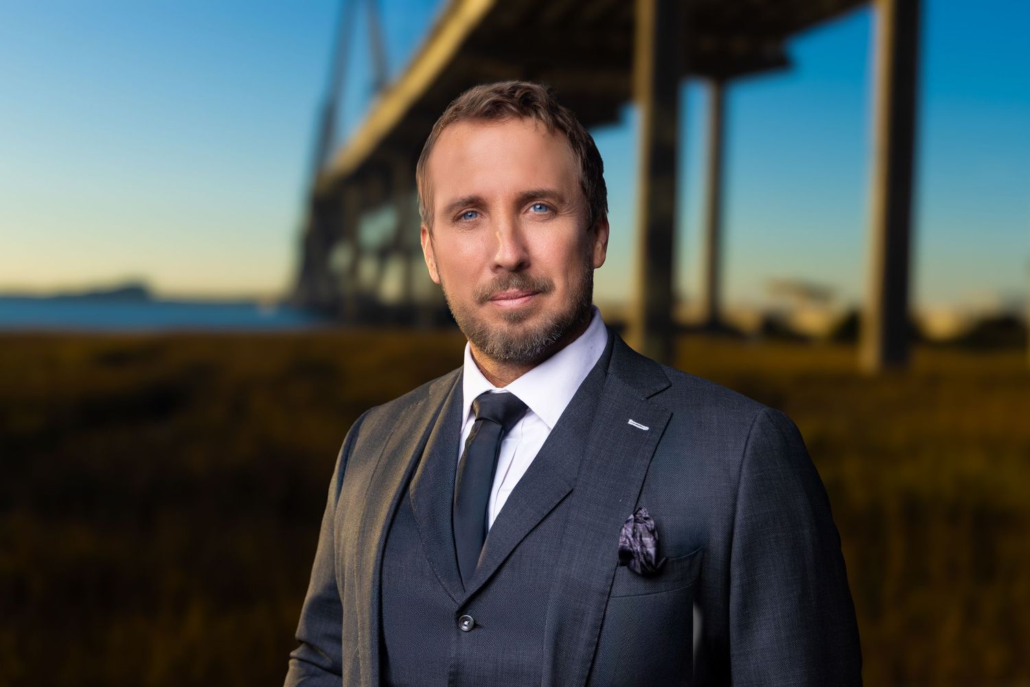 A series of six professional headshots of a person in formal business attire against various outdoor backgrounds.