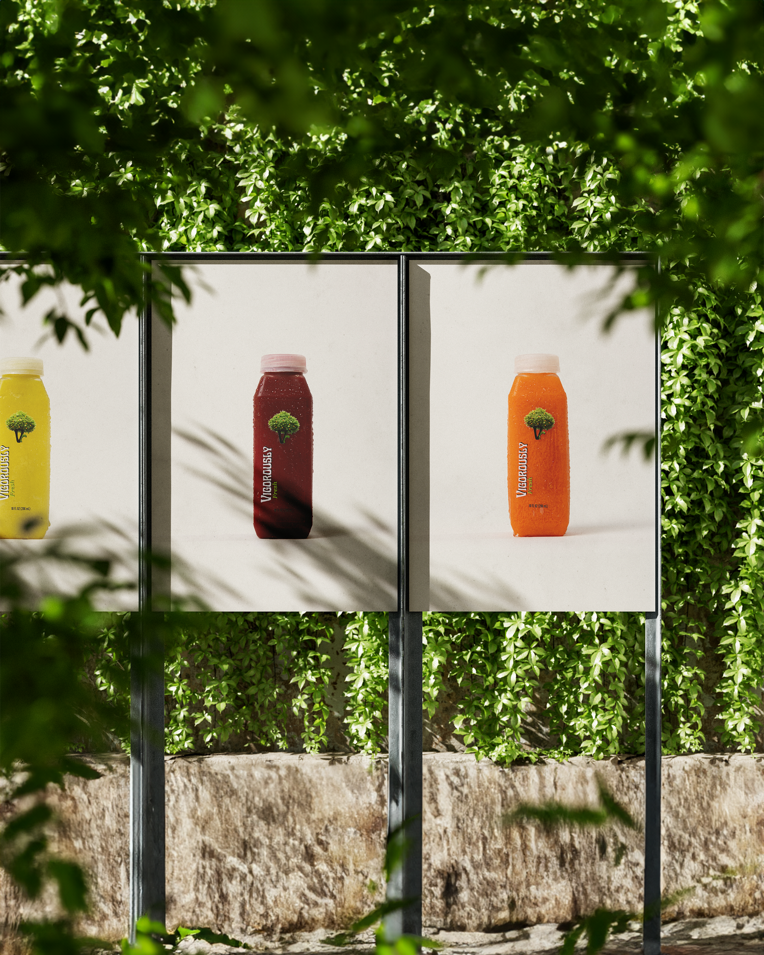 Outdoor advertising display showing colorful juice bottles against white background framed by green foliage. Portrava Creative Studios