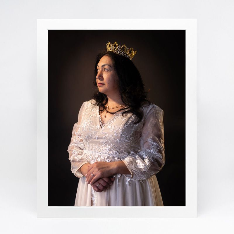 Dramatic portraits in dark lighting featuring white lace dress details.