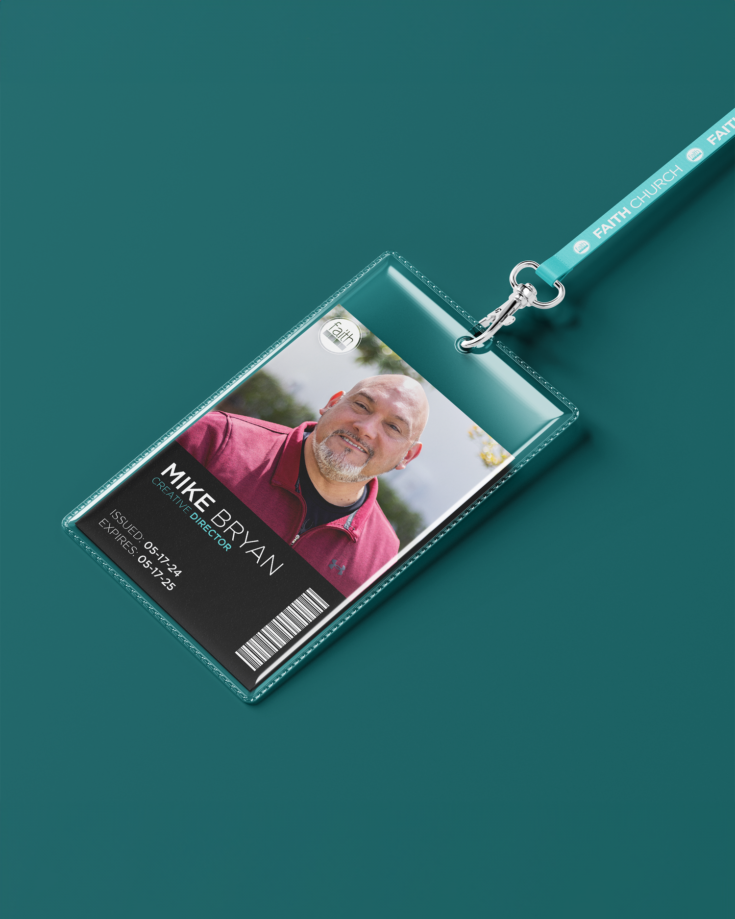 ID badge holder with lanyard against teal background. Portrava Creative Studios