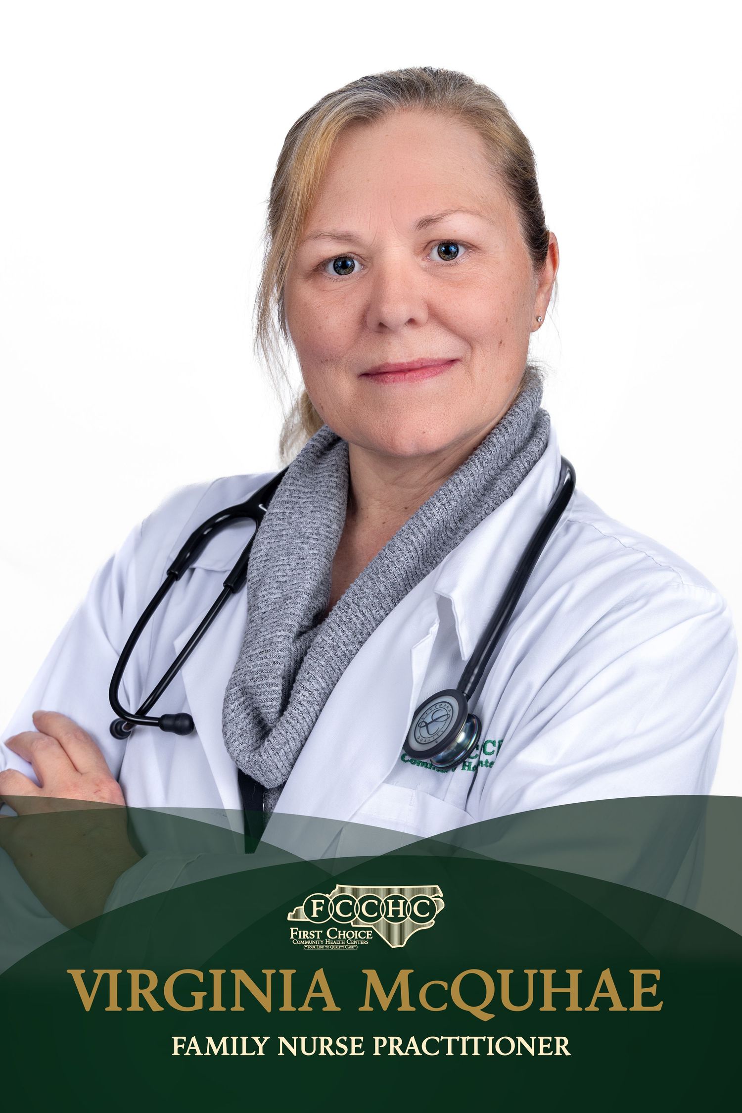 Healthcare professional in white coat and gray scarf with stethoscope poses against white background.