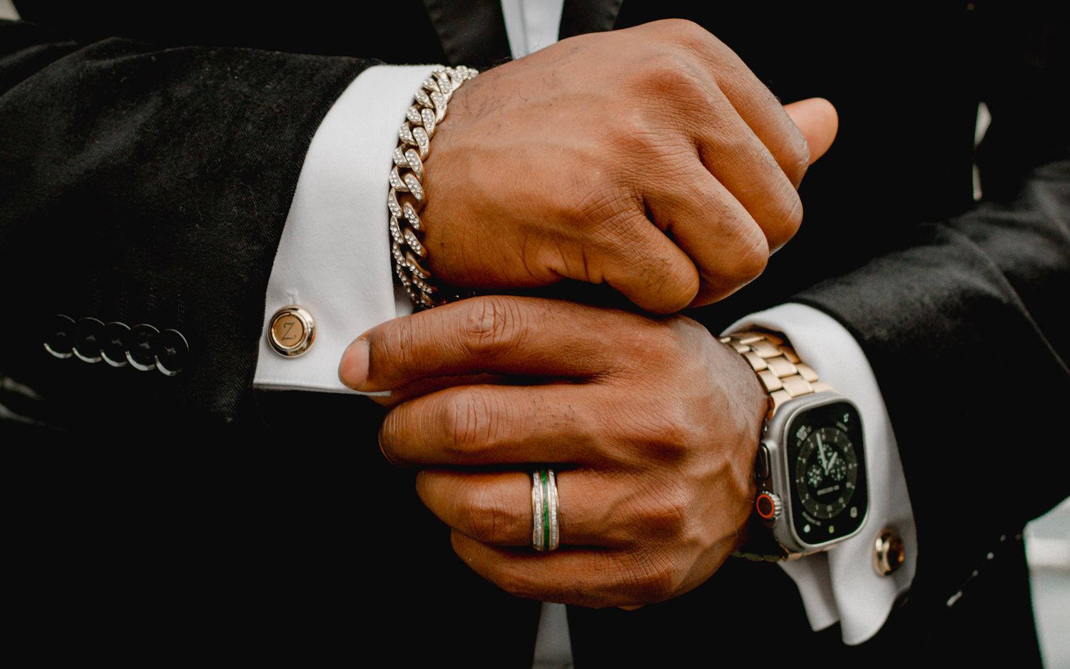 Close-up shots of grooms hands wearing formal suit attire and at The Wildflower 301 wedding venue in Greensboro, Georgia