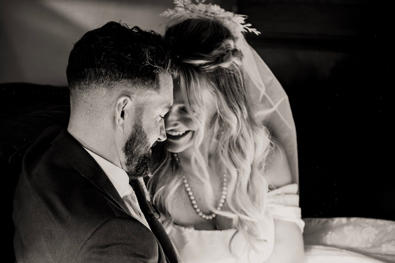 A romantic black and white wedding photo showing a moment between newlyweds their after ceremony at The Little Cottage in Smyrna, Georgia.