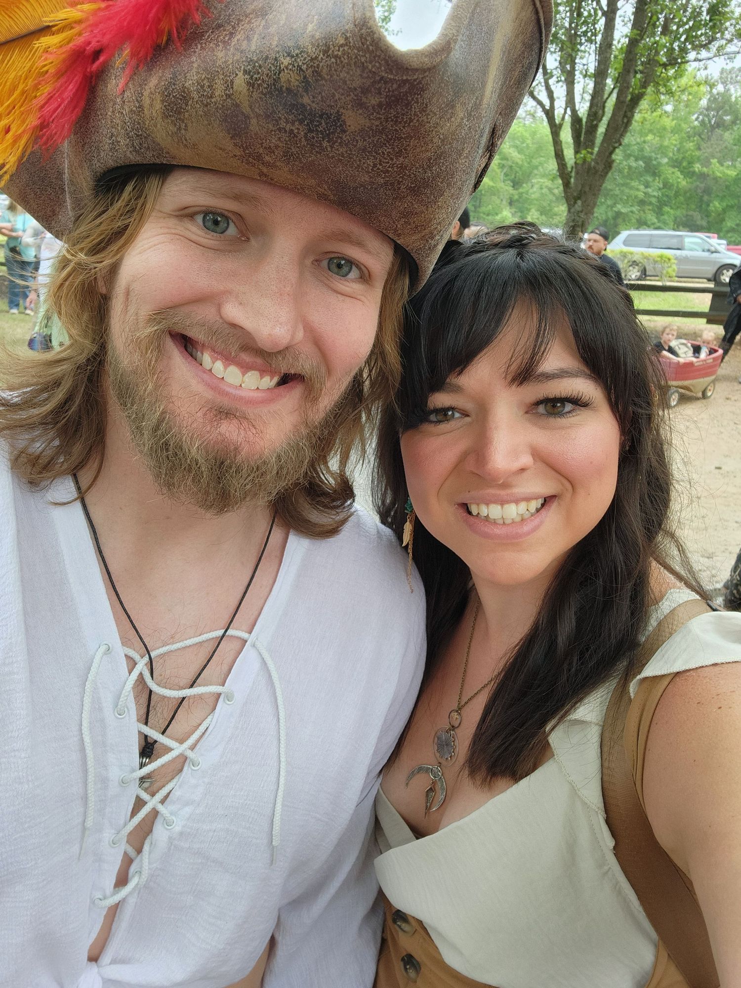 Emily Hall and husband wearing renaissance fair costumes taking a  selfie