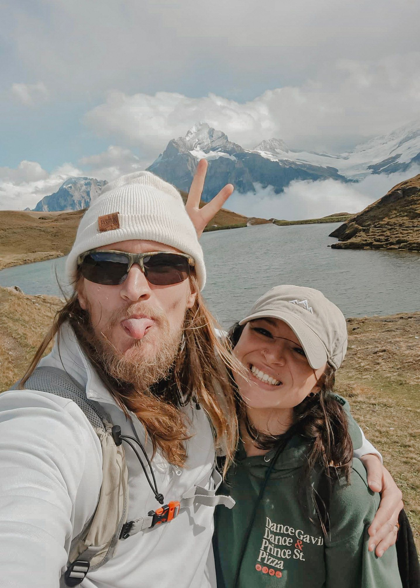 Emily Hall and husband take a selfie while hiking to Bachalpsee lake in Grindelwald, Switzerland