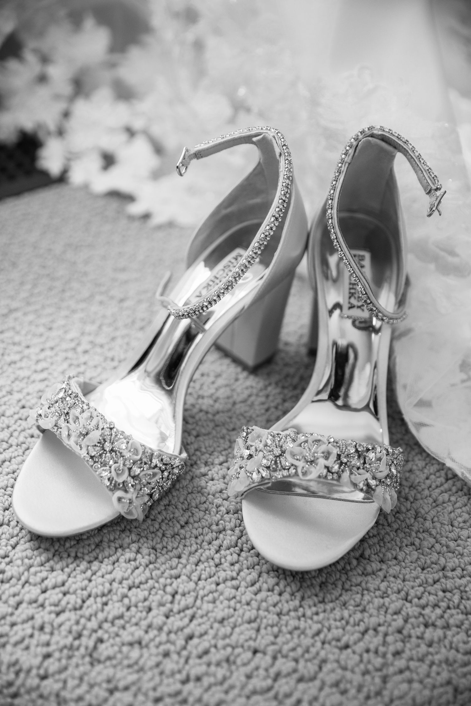 Elegant crystal-embellished bridal heels with ankle straps and block heels photographed in black and white In Canmore