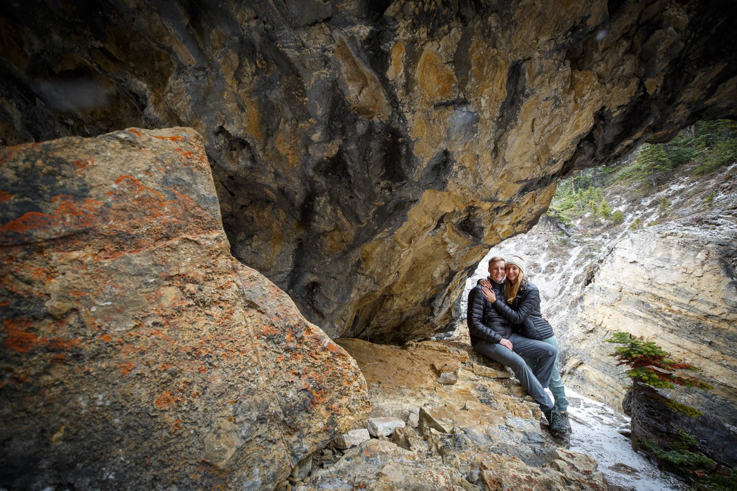 A series of connected photos showing a rocky canyon with flowing water and hikers exploring the rugged terrain in Banff
