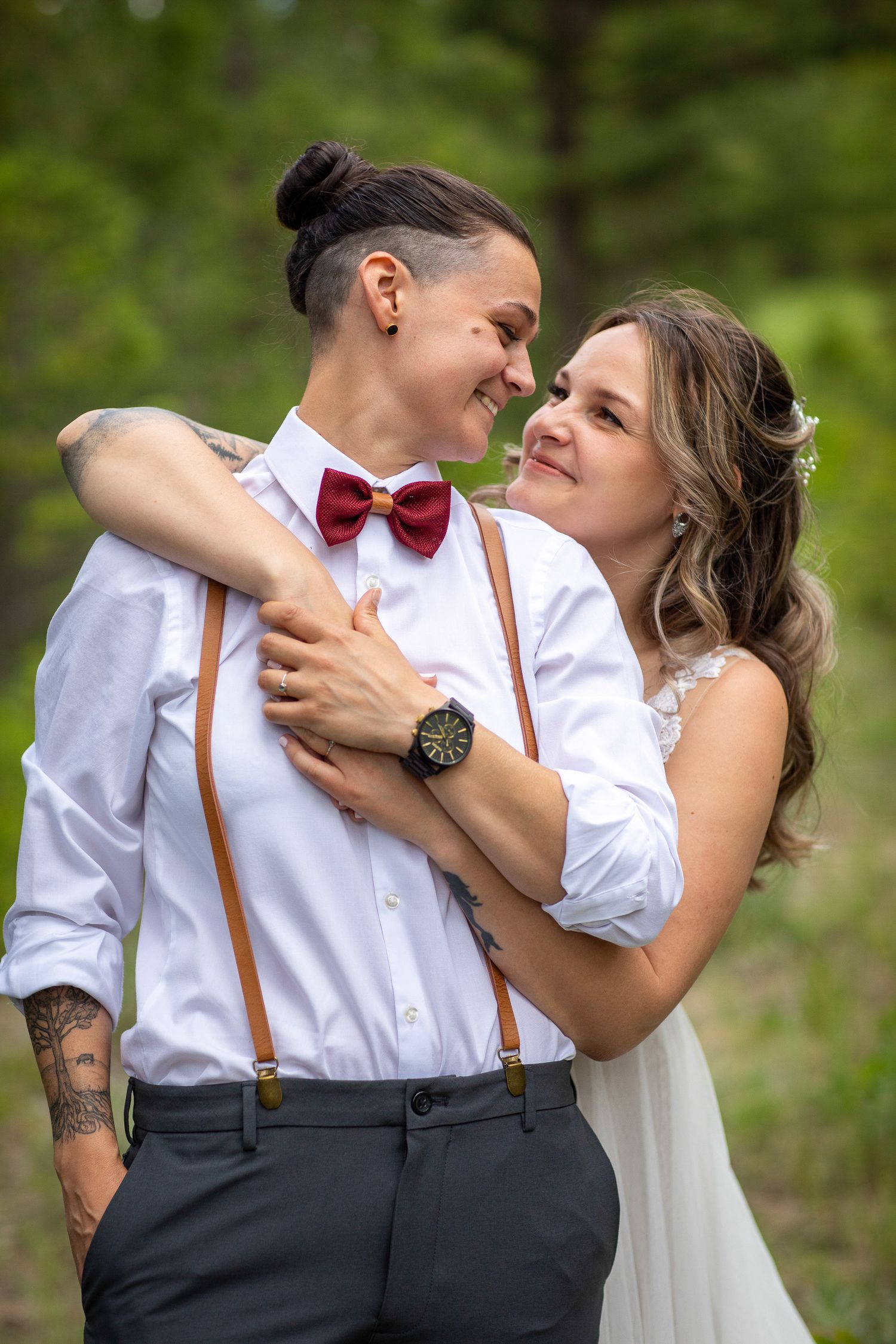 A romantic outdoor wedding photo sequence showing a couple embracing and dancing in white shirt and suspenders. Radium, BC