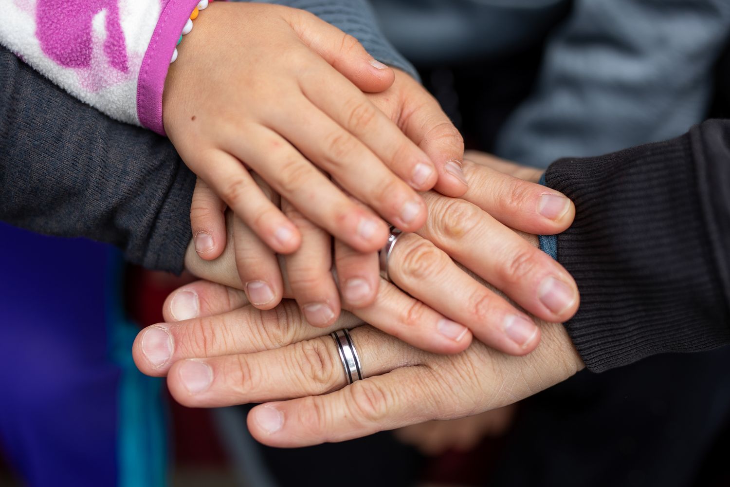 Close-up series of hands with wedding rings showing engagement and marriage symbolism.