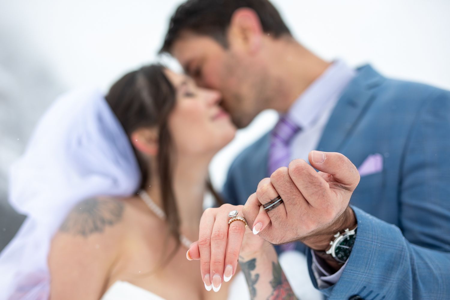 A romantic wedding photo series showing tender moments between a couple in formal attire against a light background at Lake Louise, Alberta.