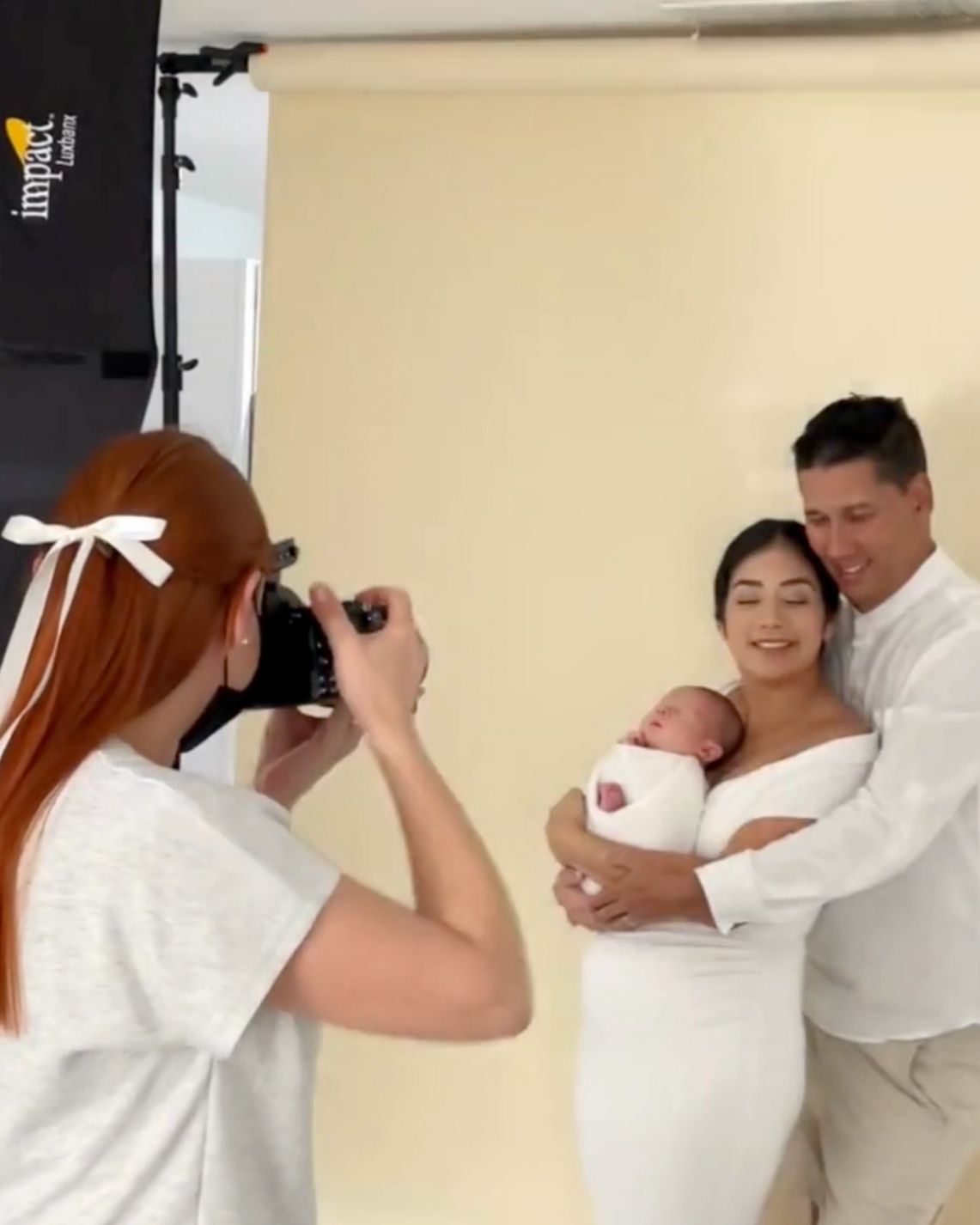 A sequence of six photos showing a romantic dance dip pose in white outfits against a light colored wall.