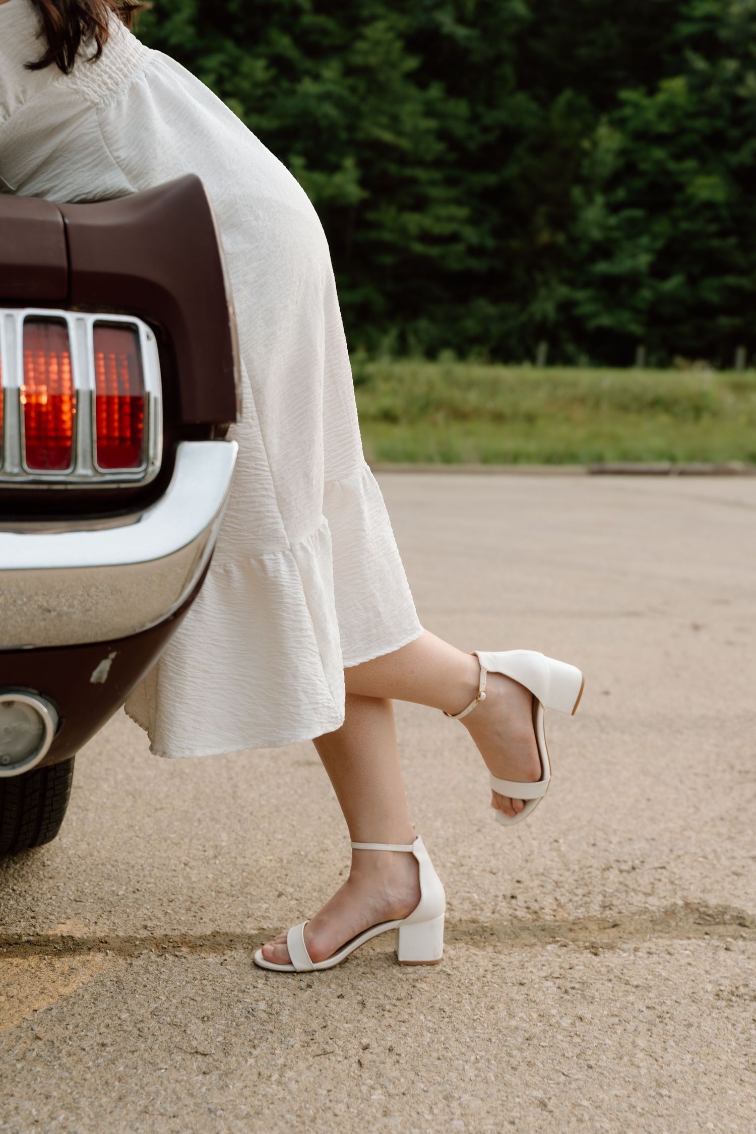 Romantic engagement photos featuring a vintage car at Lake Monroe in Bloomington, Indiana.