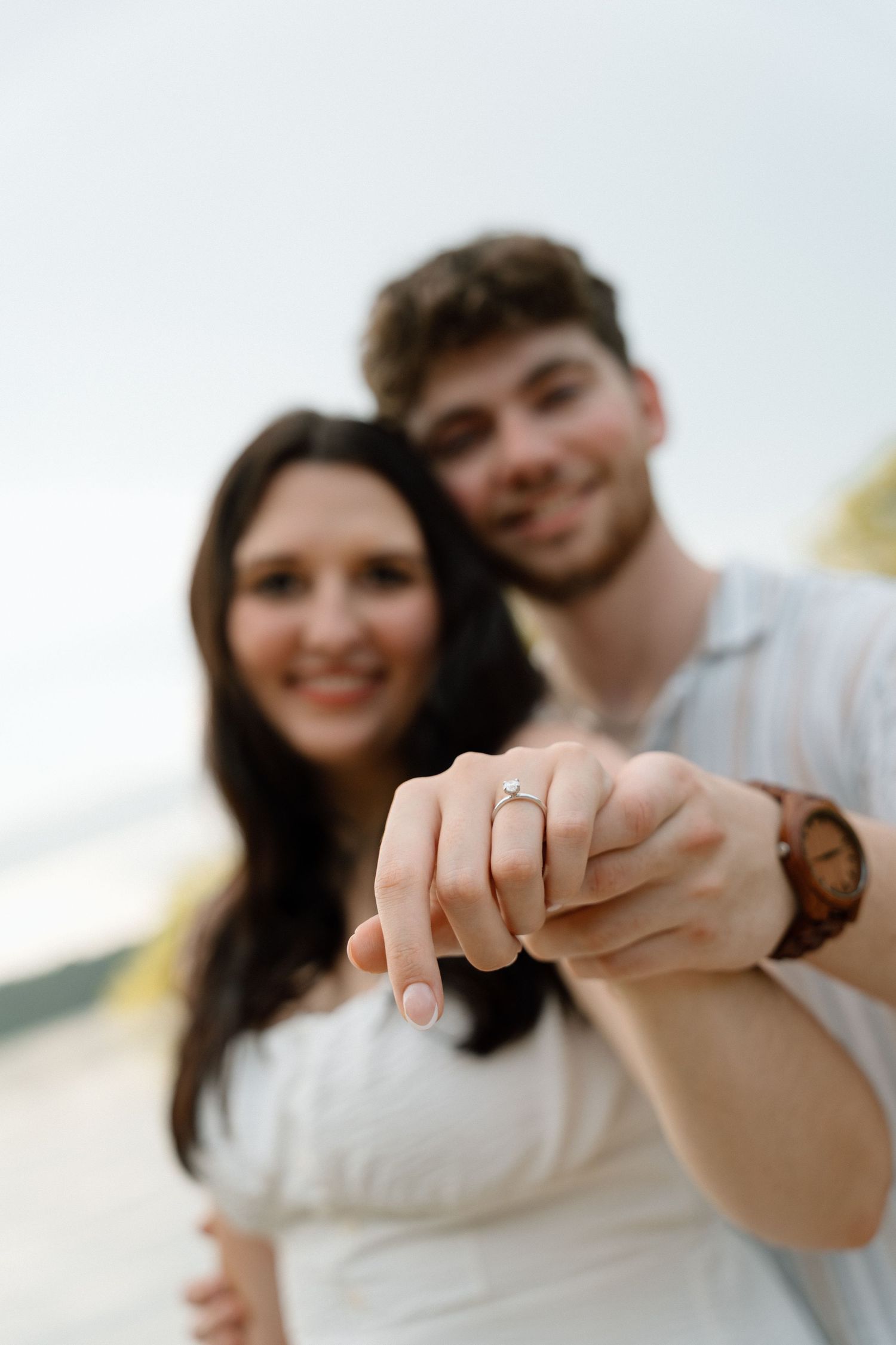 Romantic engagement photos featuring a vintage car at Lake Monroe in Bloomington, Indiana.