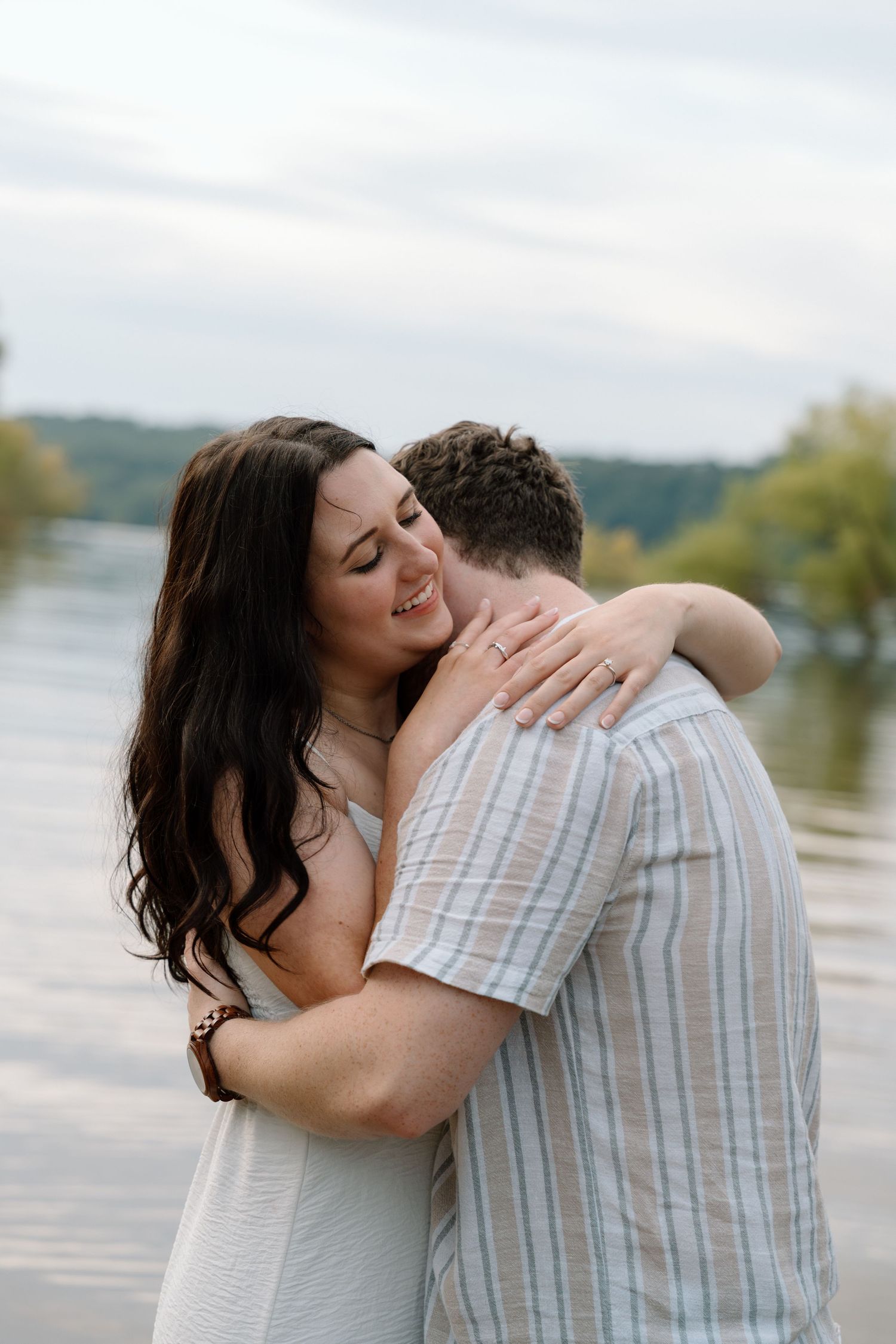 Romantic engagement photos featuring a vintage car at Lake Monroe in Bloomington, Indiana.