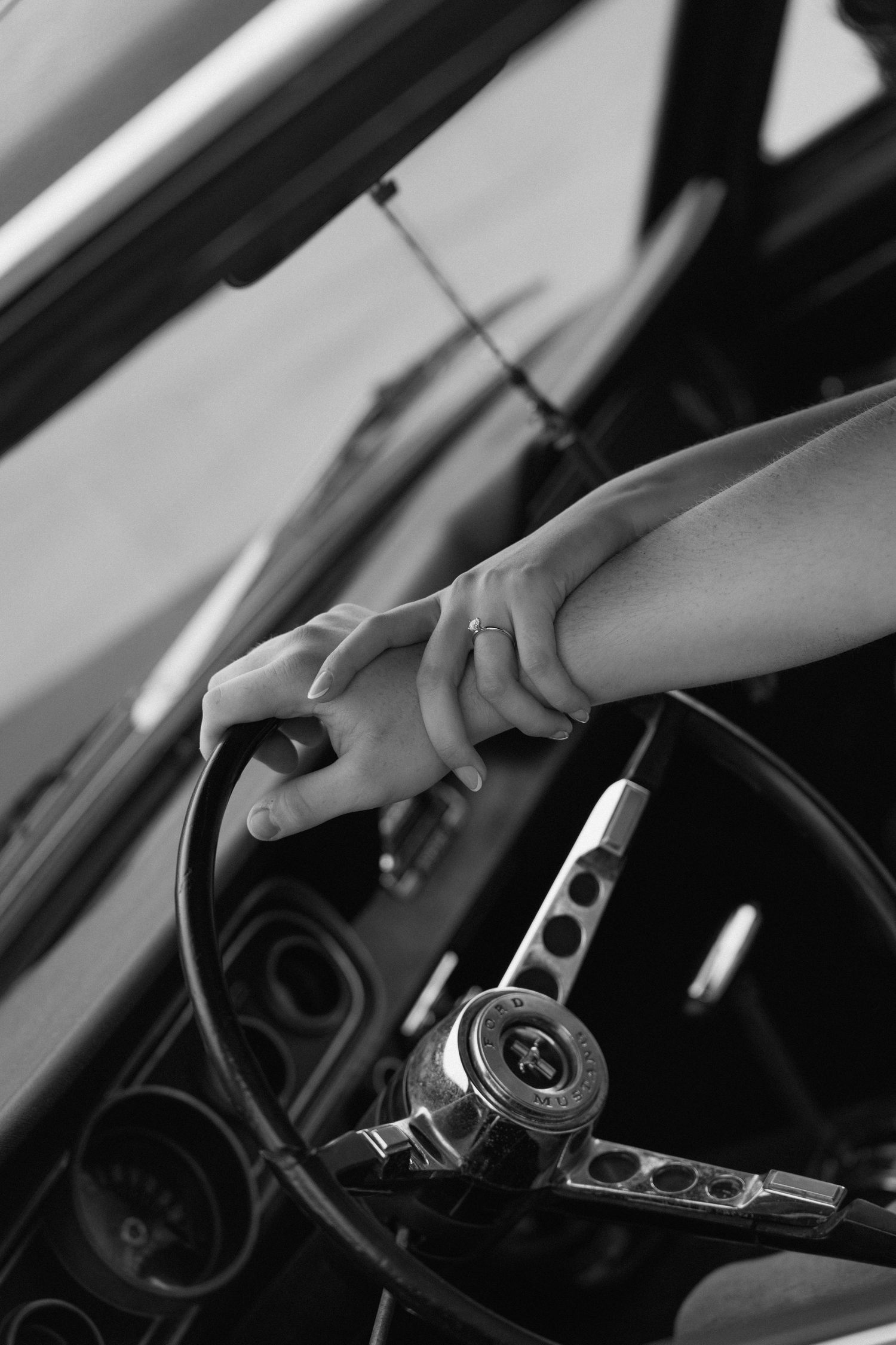 Romantic engagement photos featuring a vintage car at Lake Monroe in Bloomington, Indiana.