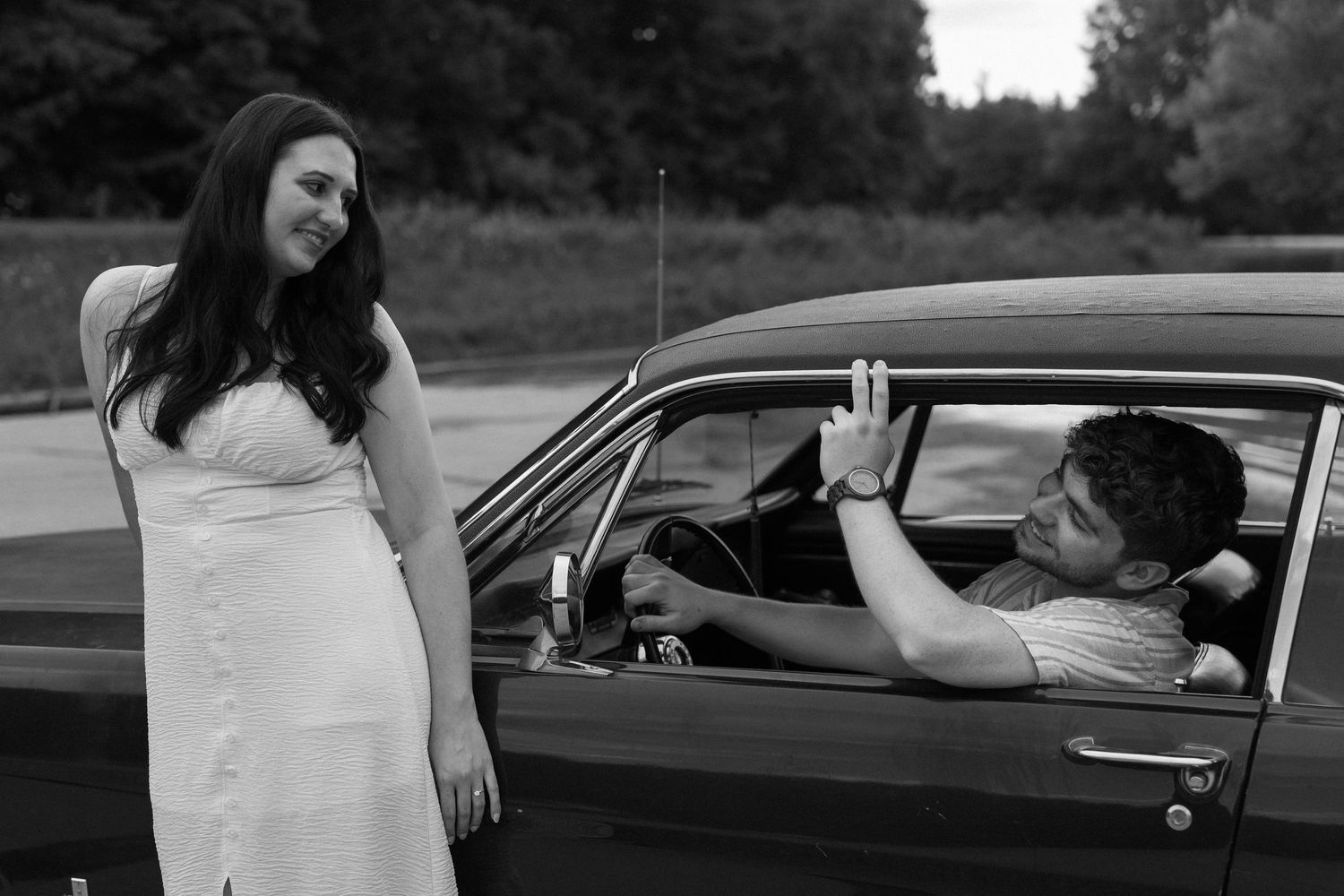 Romantic engagement photos featuring a vintage car at Lake Monroe in Bloomington, Indiana.