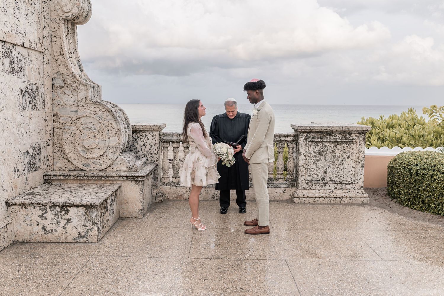 A sequence of proposal photos captured on a stone balcony overlooking a scenic view.