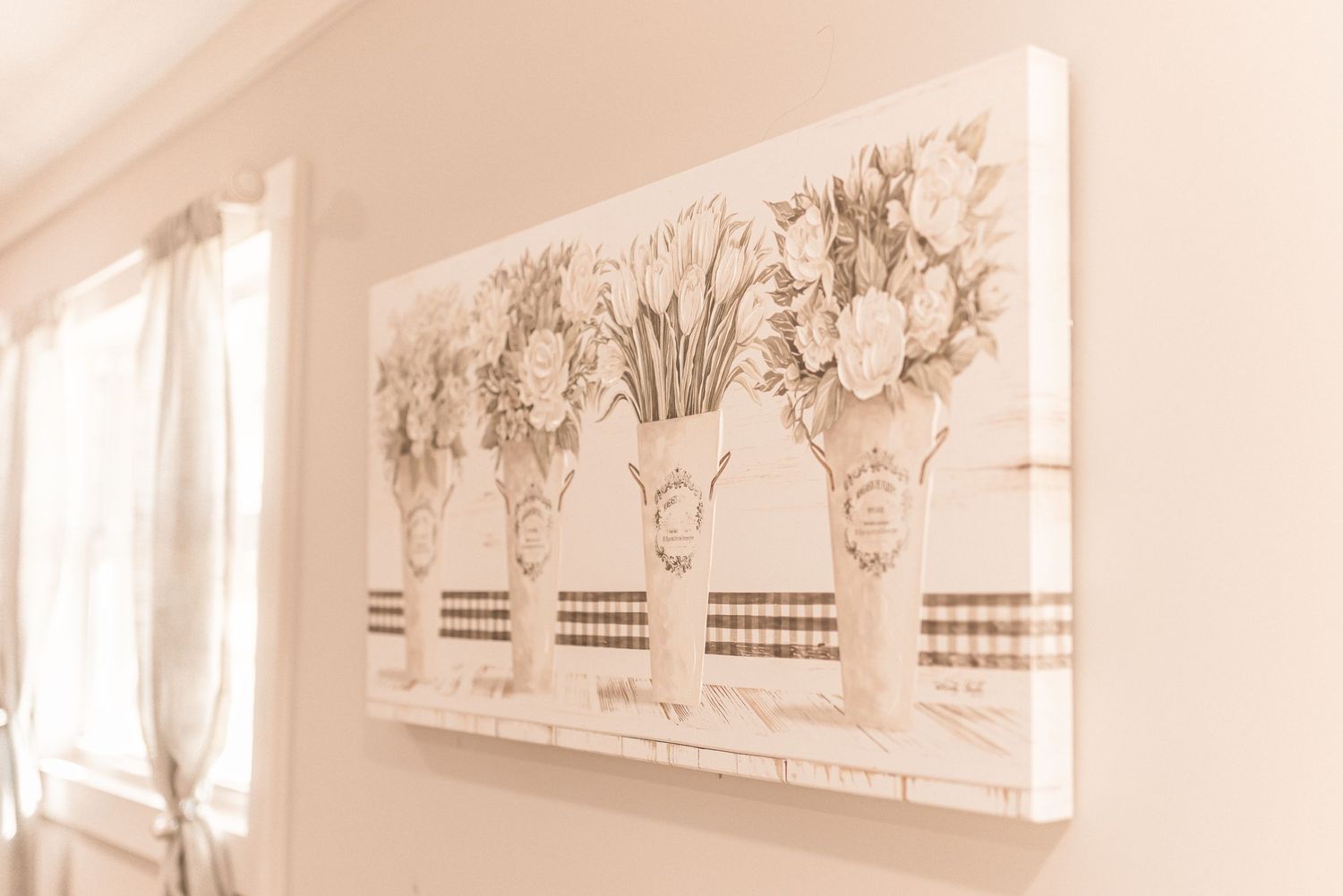 Ornate white crown molding and decorative architectural details adorn the ceiling of an elegant interior space.