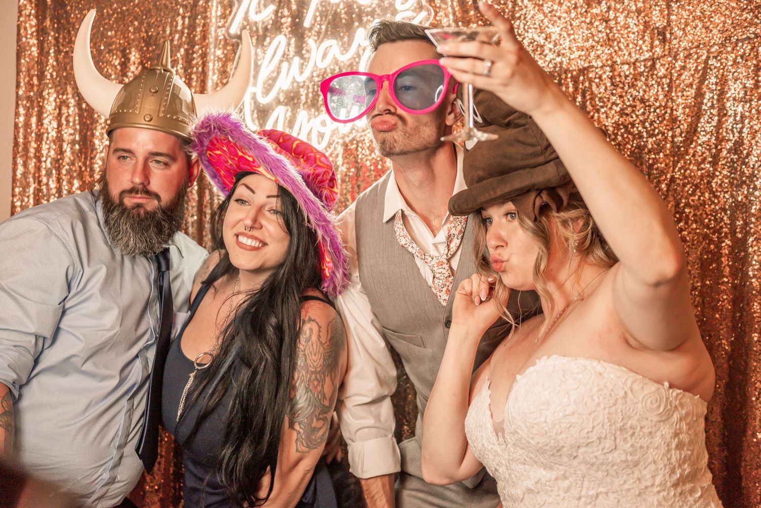 Multiple people pose playfully against a sparkly gold backdrop in festive photo booth style shots.