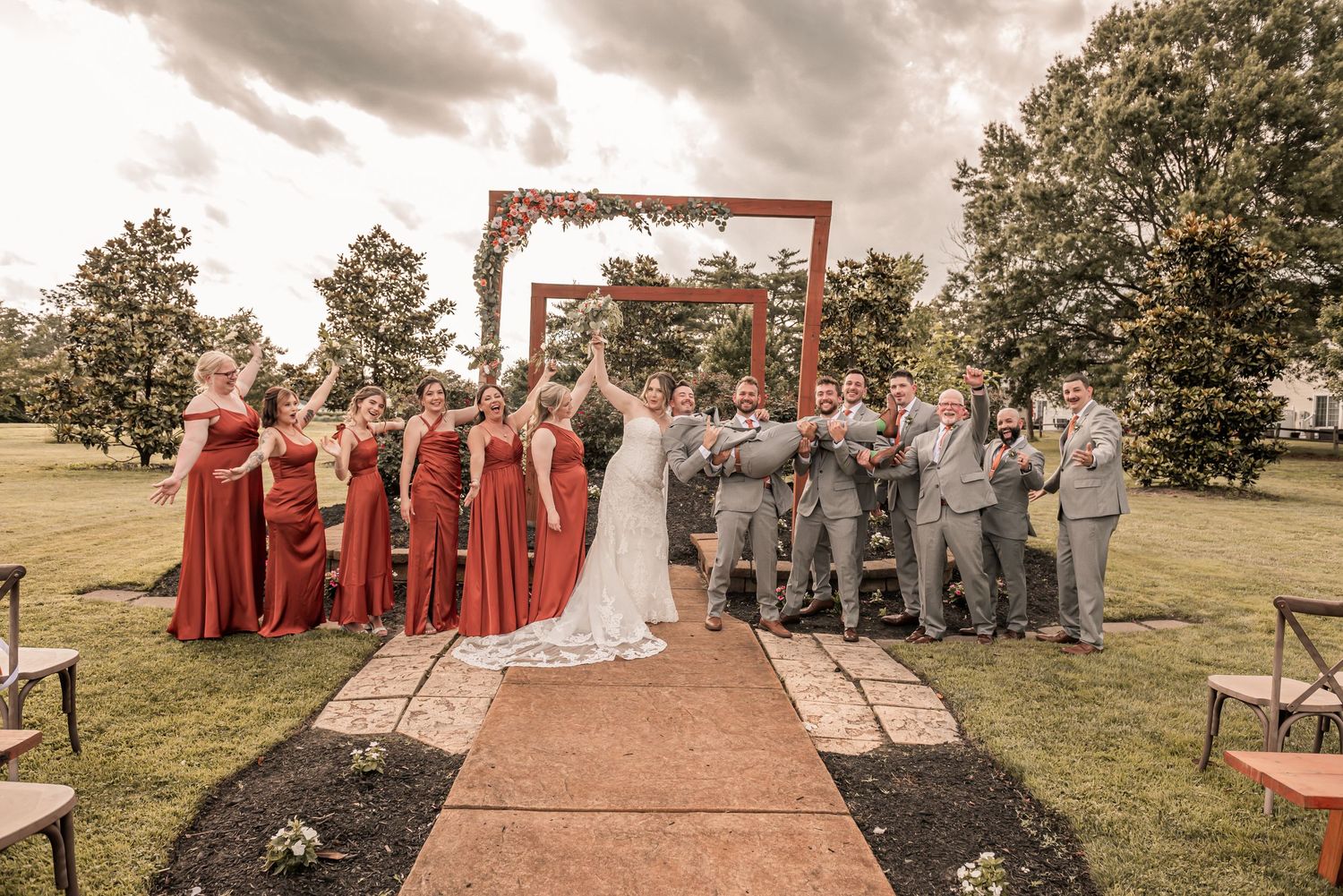 Wedding party stands in a split view panorama photo showing multiple poses and angles in an outdoor garden setting.