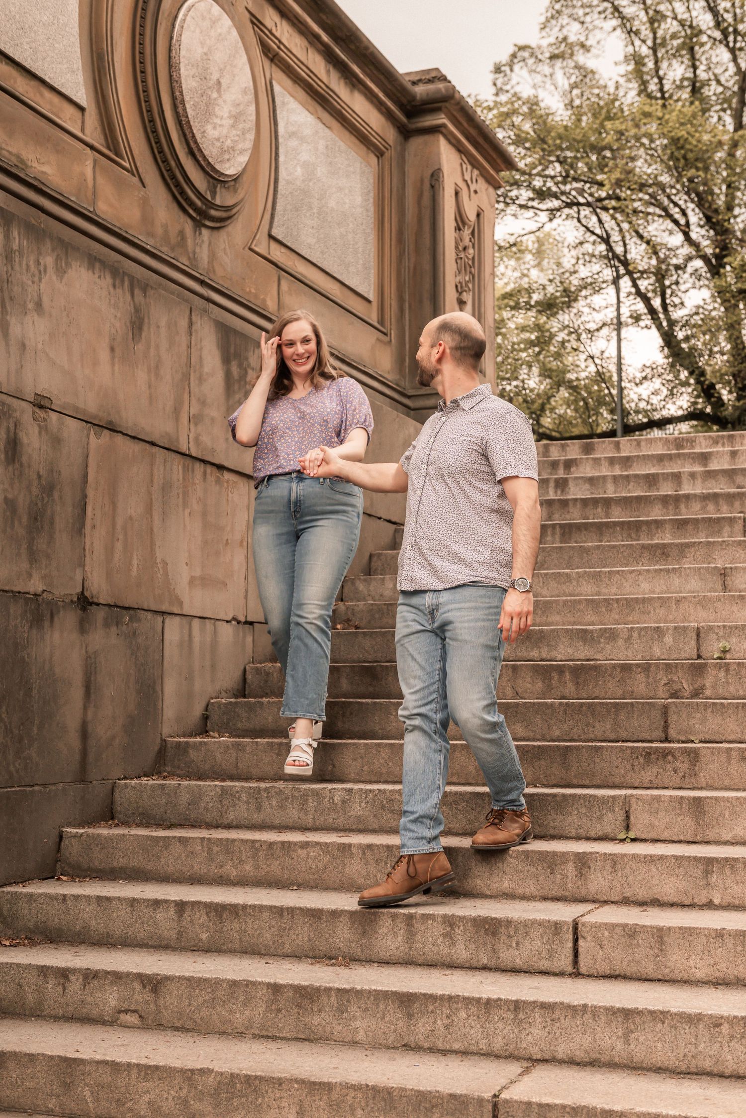 A couple ascends stone steps in a romantic proposal moment captured in a five-photo sequence.