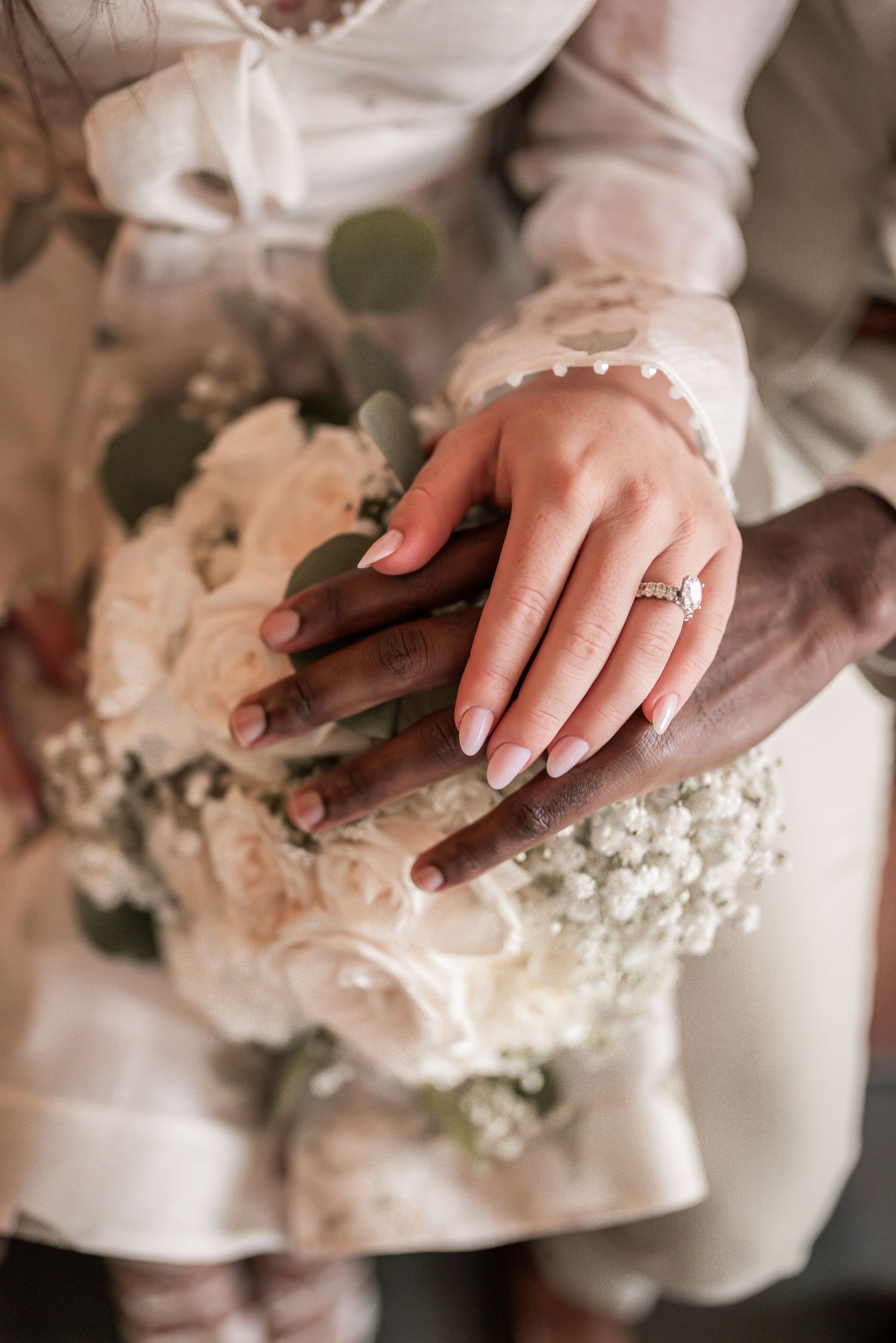 Close-up sequence of hands kneading and working with bread dough on a floured surface.