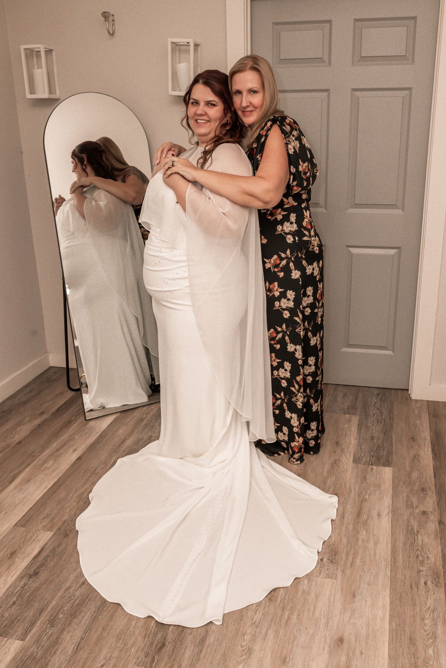 A series of photos showing a wedding dress fitting session in a dressing room with light wood flooring.