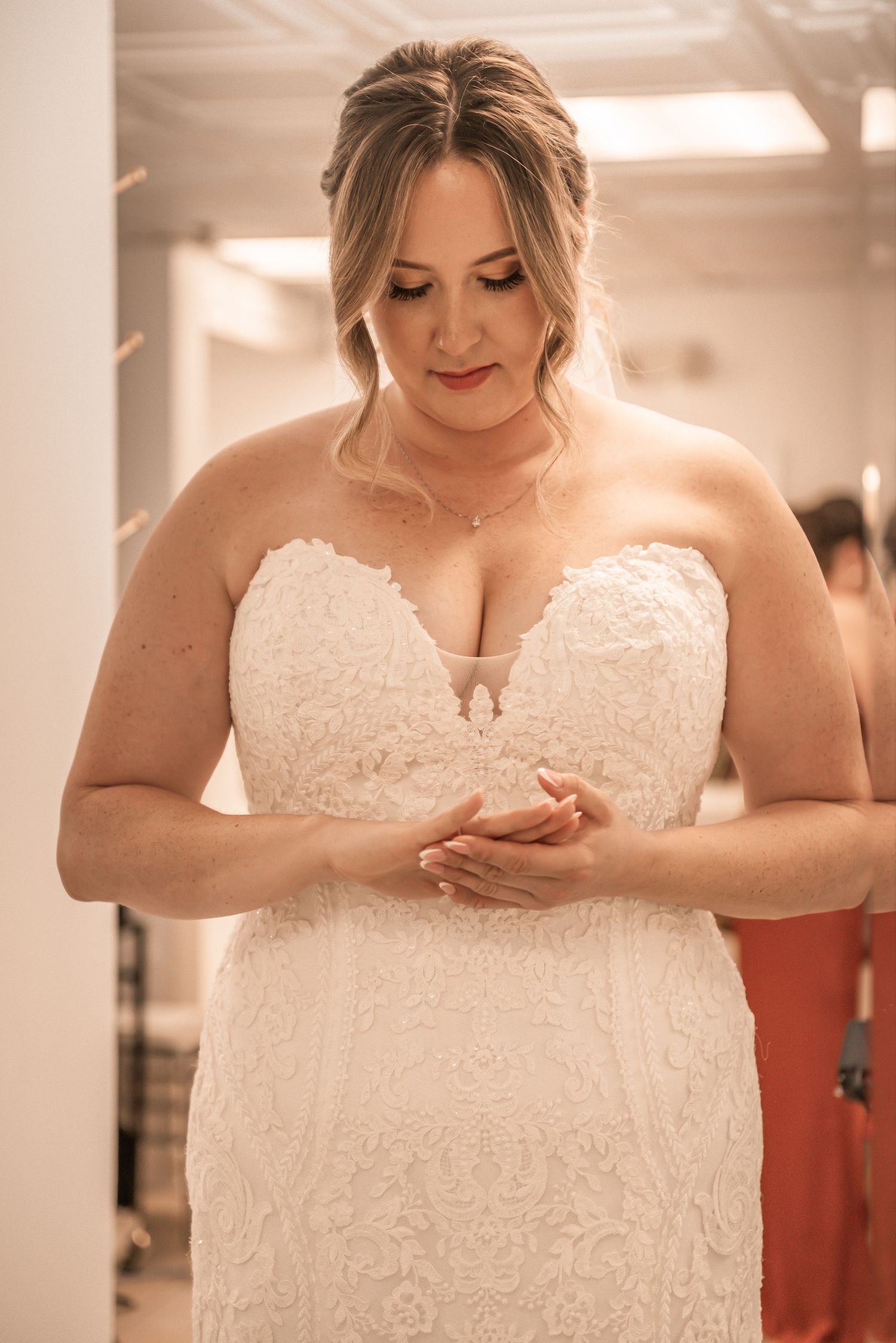 Close-up sequence showing details of an elegant white lace wedding dress bodice.