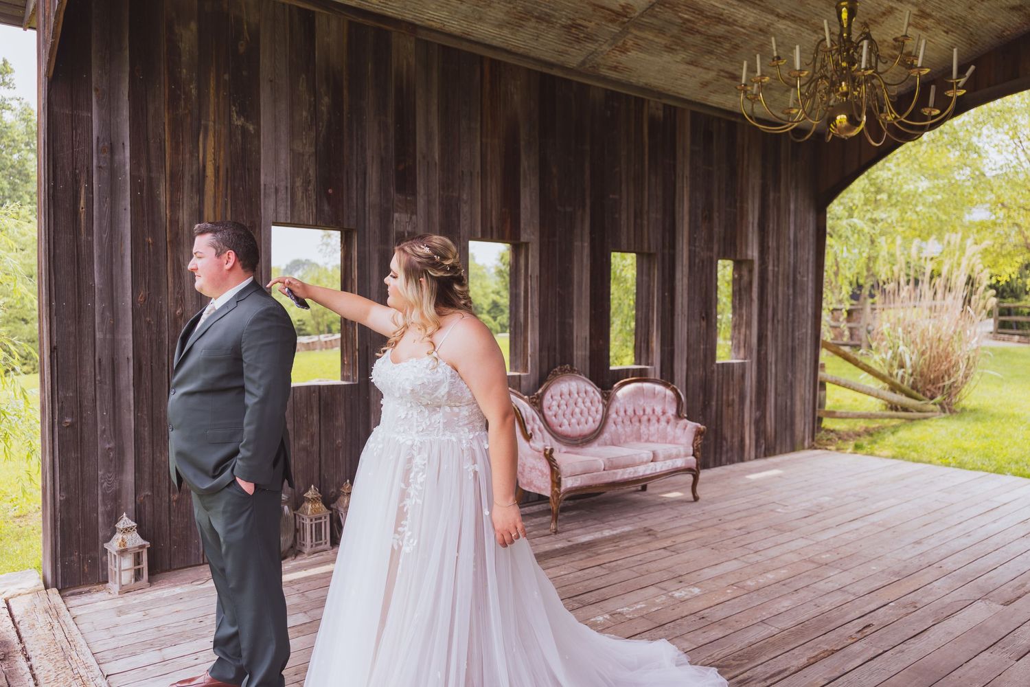 Wedding celebration scene in a rustic wooden barn with decorative details and festive atmosphere.
