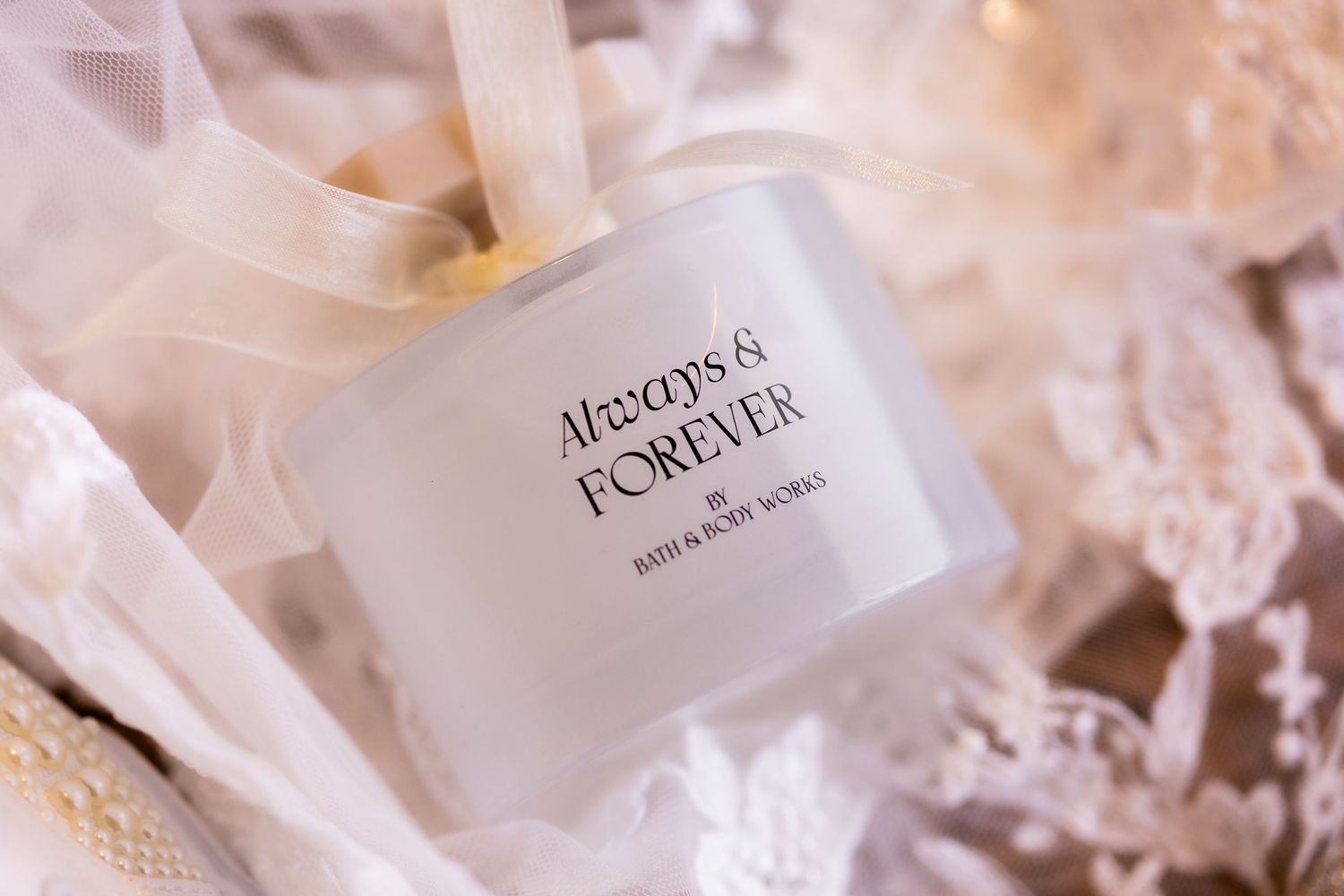 Elegant frosted glass perfume bottles and crystal accessories arranged in soft, dreamy lighting.