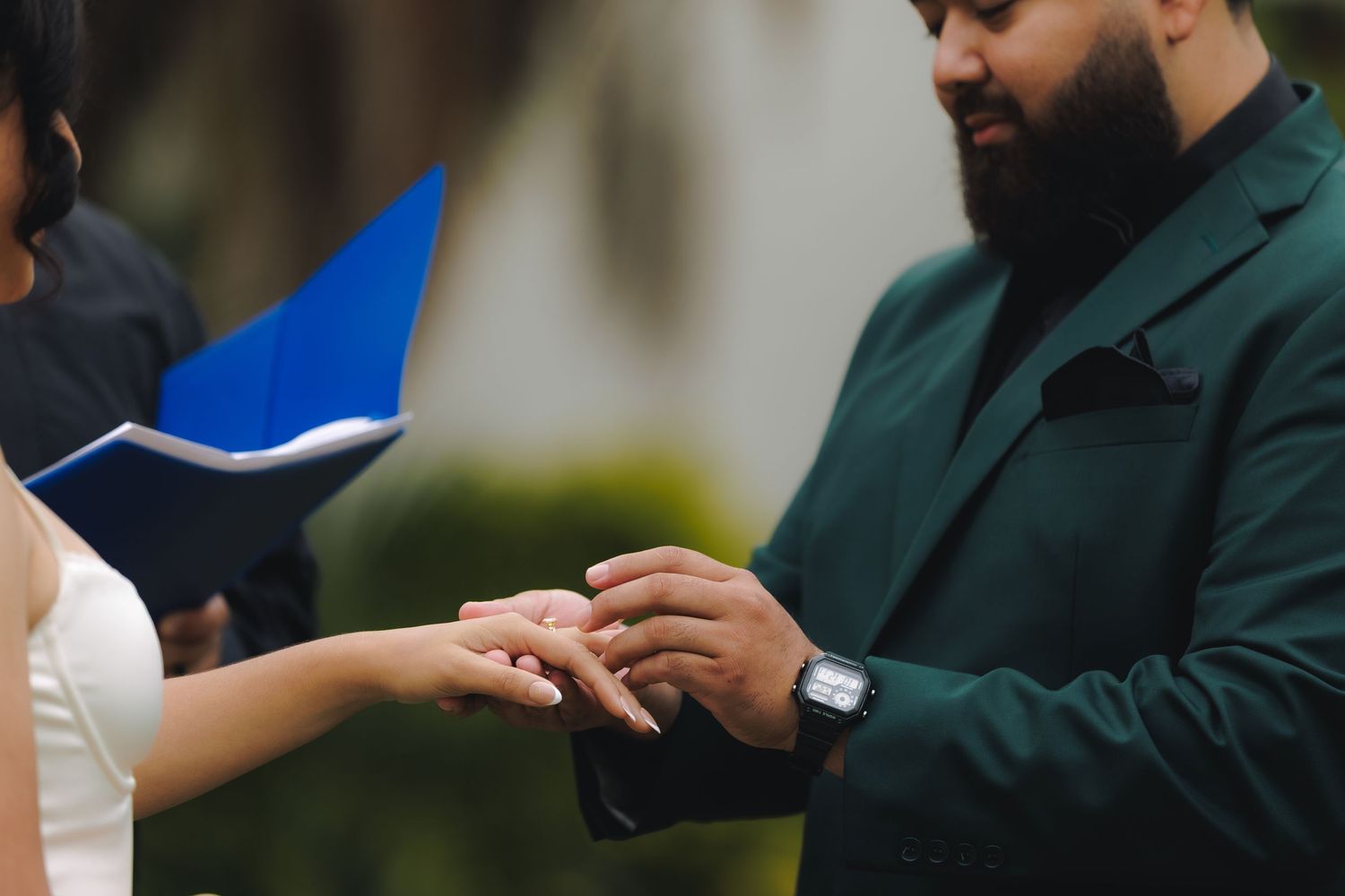 A close-up view of hands exchanging business cards during a professional networking event.