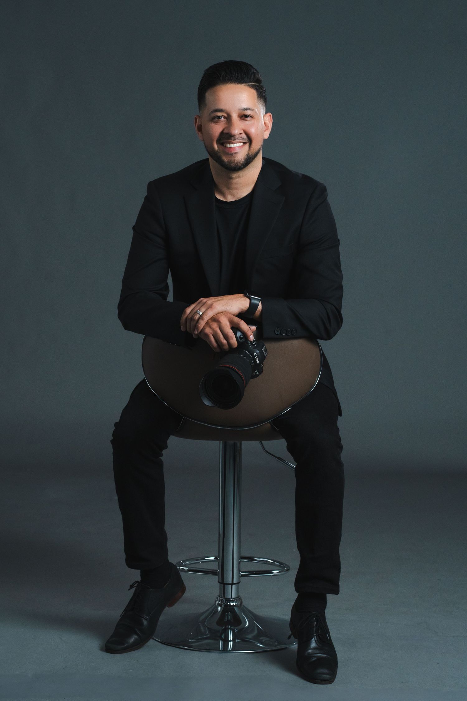 Studio portrait session showing different poses against dark grey background.