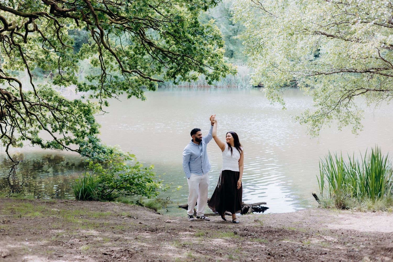 Couple celebrating their engagement at Cannop Ponds.