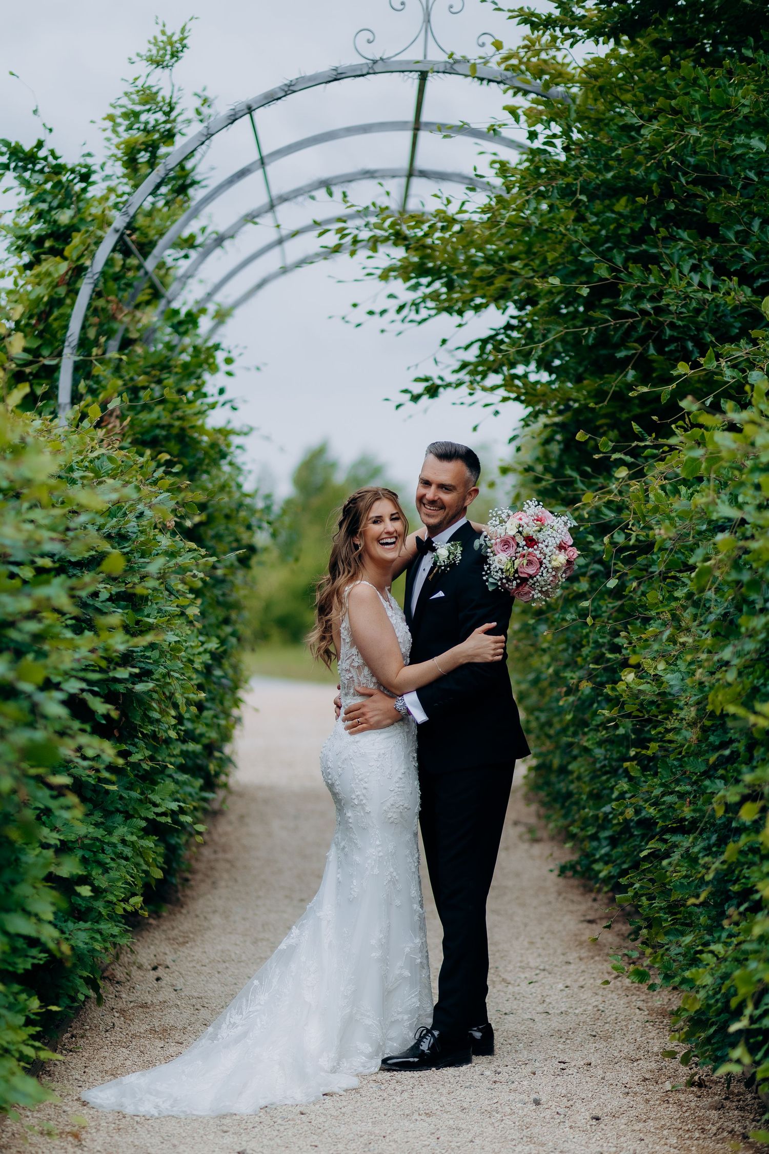 A couple in wedding attire share a romantic moment together at old gore wedding venue.