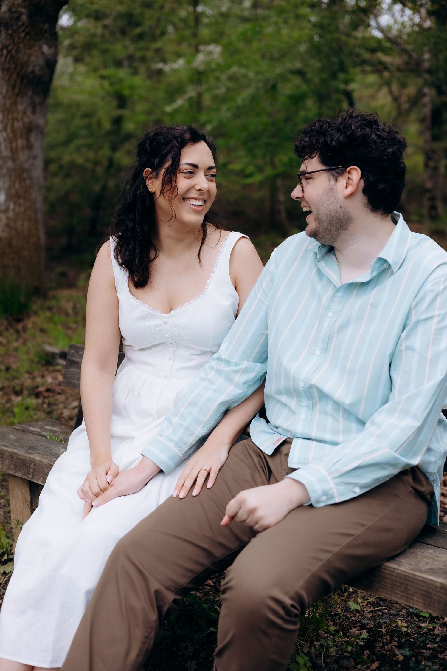 Natural lifestyle engagement shoot in Gloucestershire woodland by documentary wedding photographer capturing real moments.
