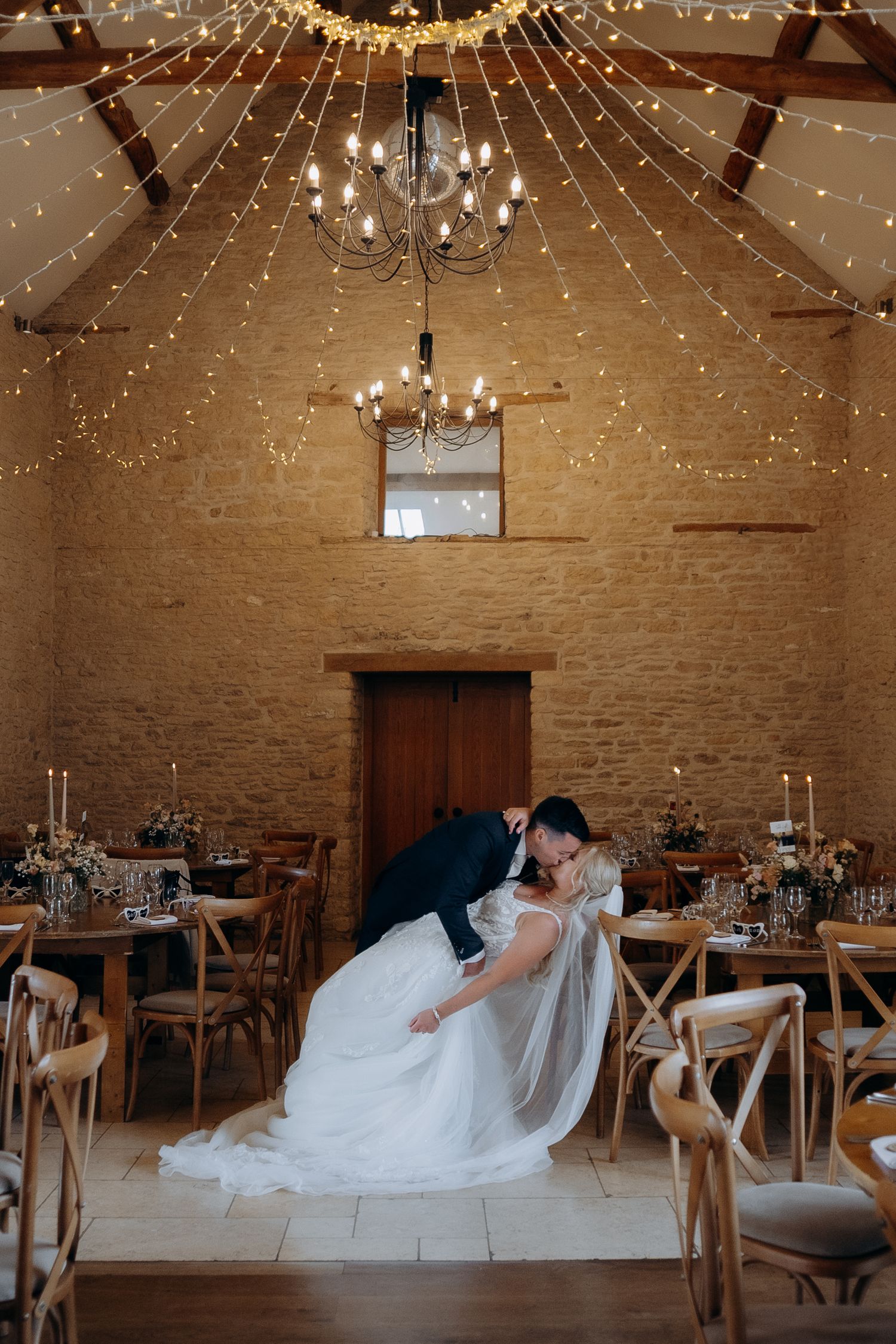 A romantic wedding in the Cotswolds at Kingscote Barn wedding venue.