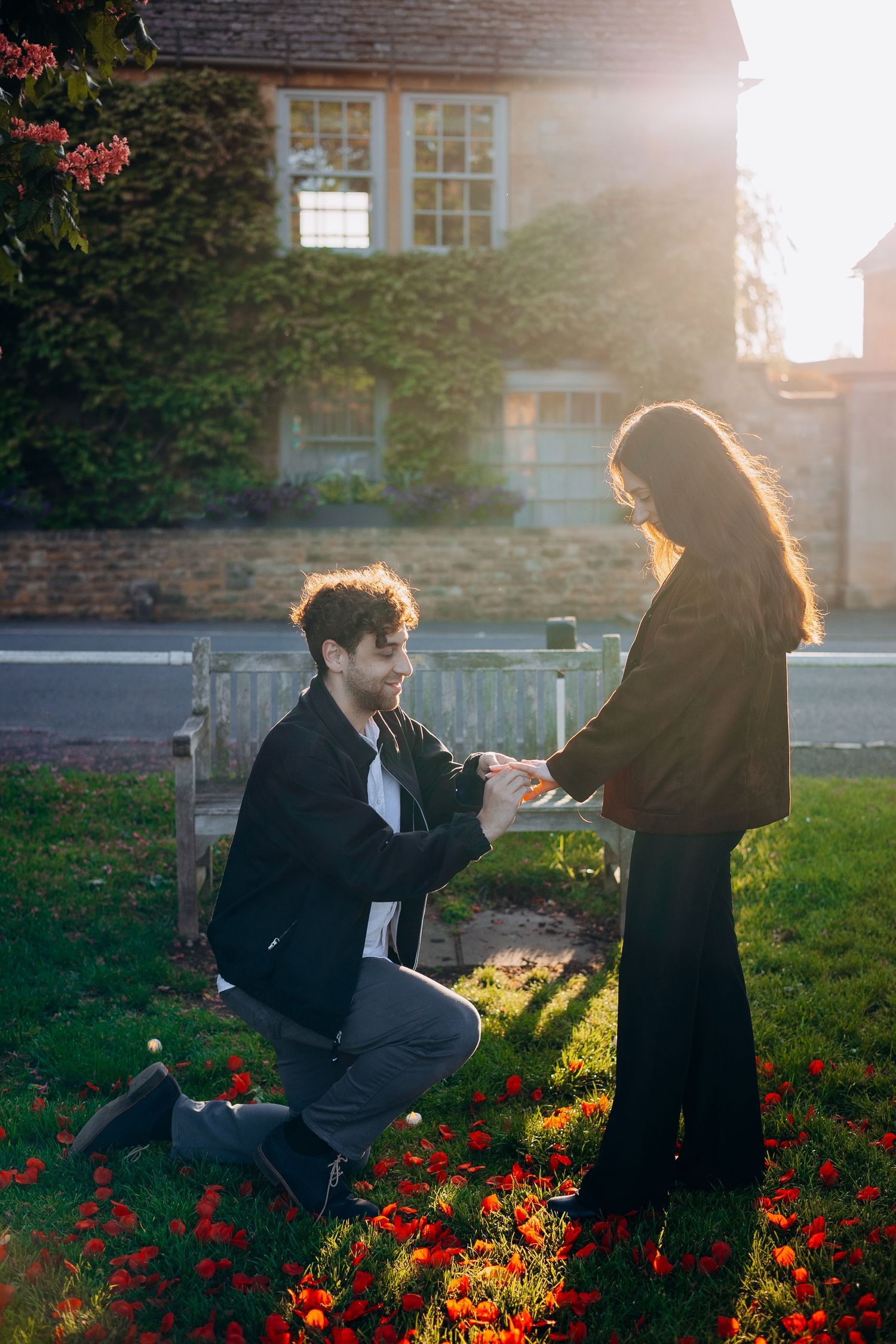 Proposal photography in Broadway with rose petals and candles.