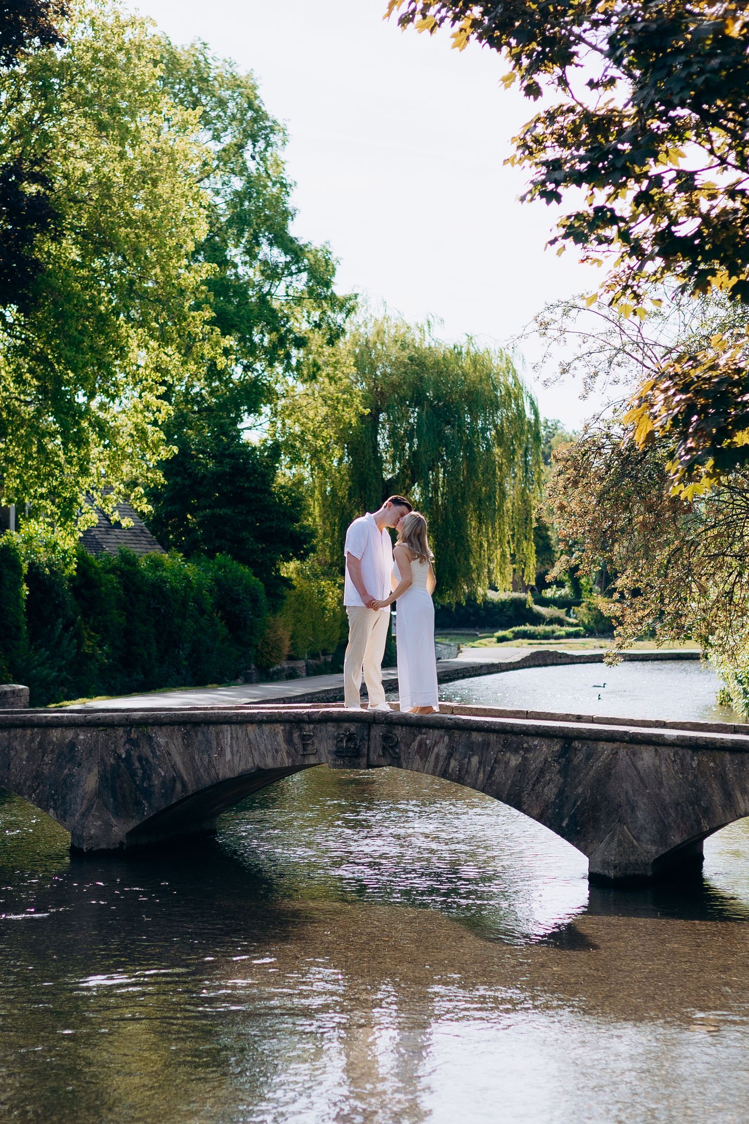 Bourton-on-the-Water proposal photographer capturing a surprise proposal in the Cotswolds.